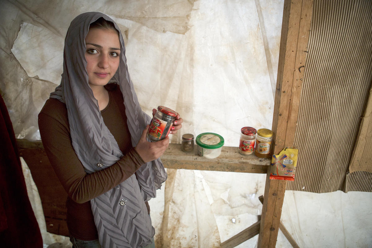 Syrian girl in Lebanon showing what little food she and her family have