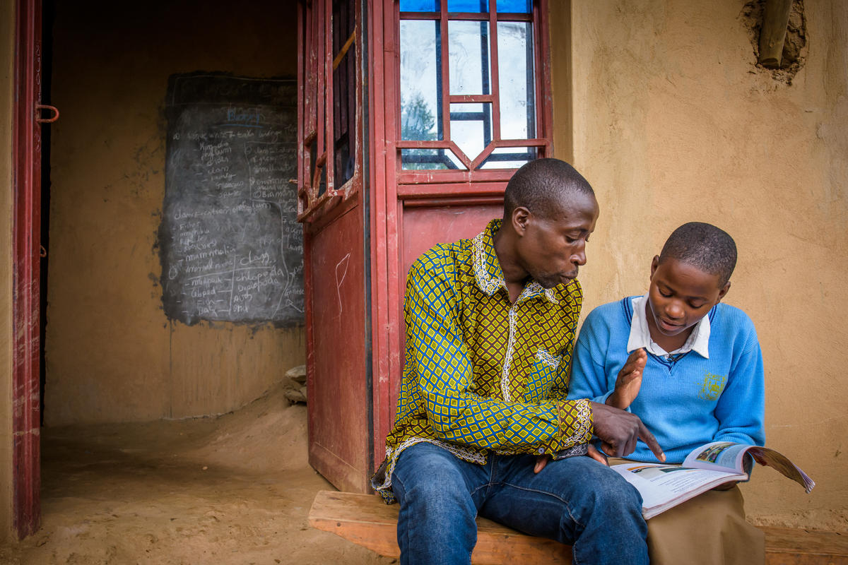 Isabelle and her father read her homework