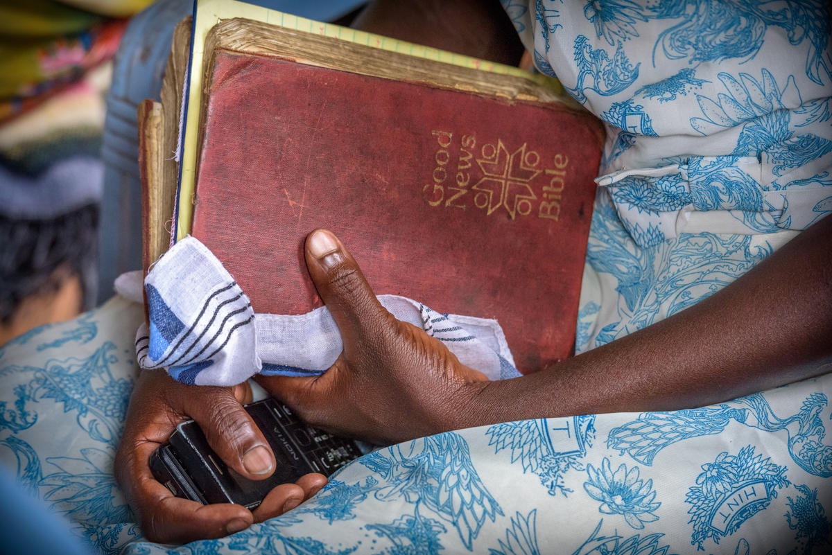 woman holding a Bible