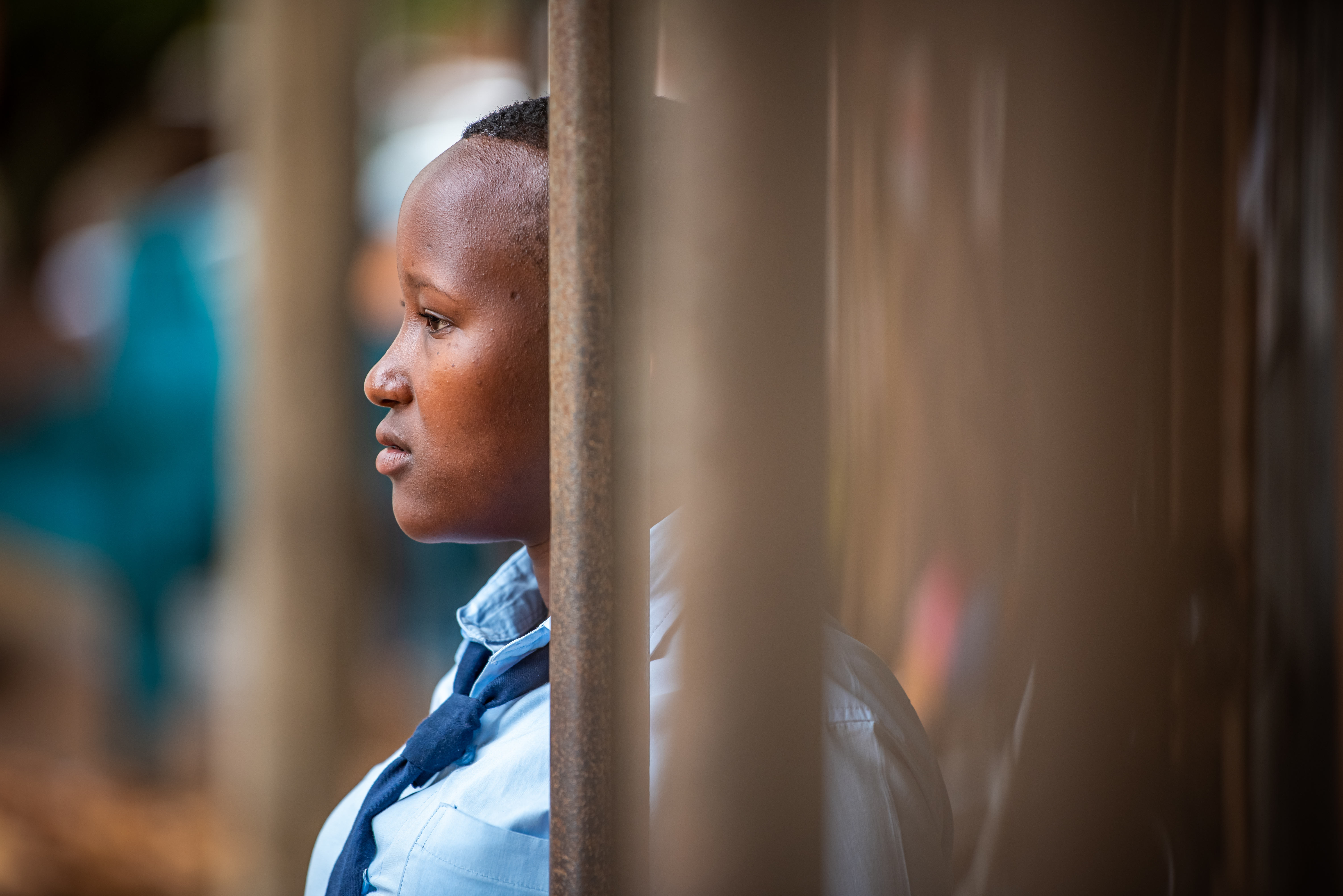 Girl in Uganda facing left