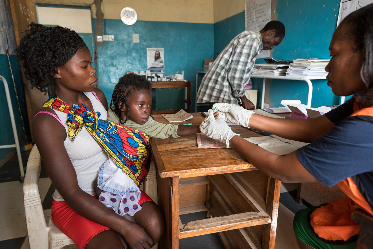 Three-year-old Bertha gets a malaria test.