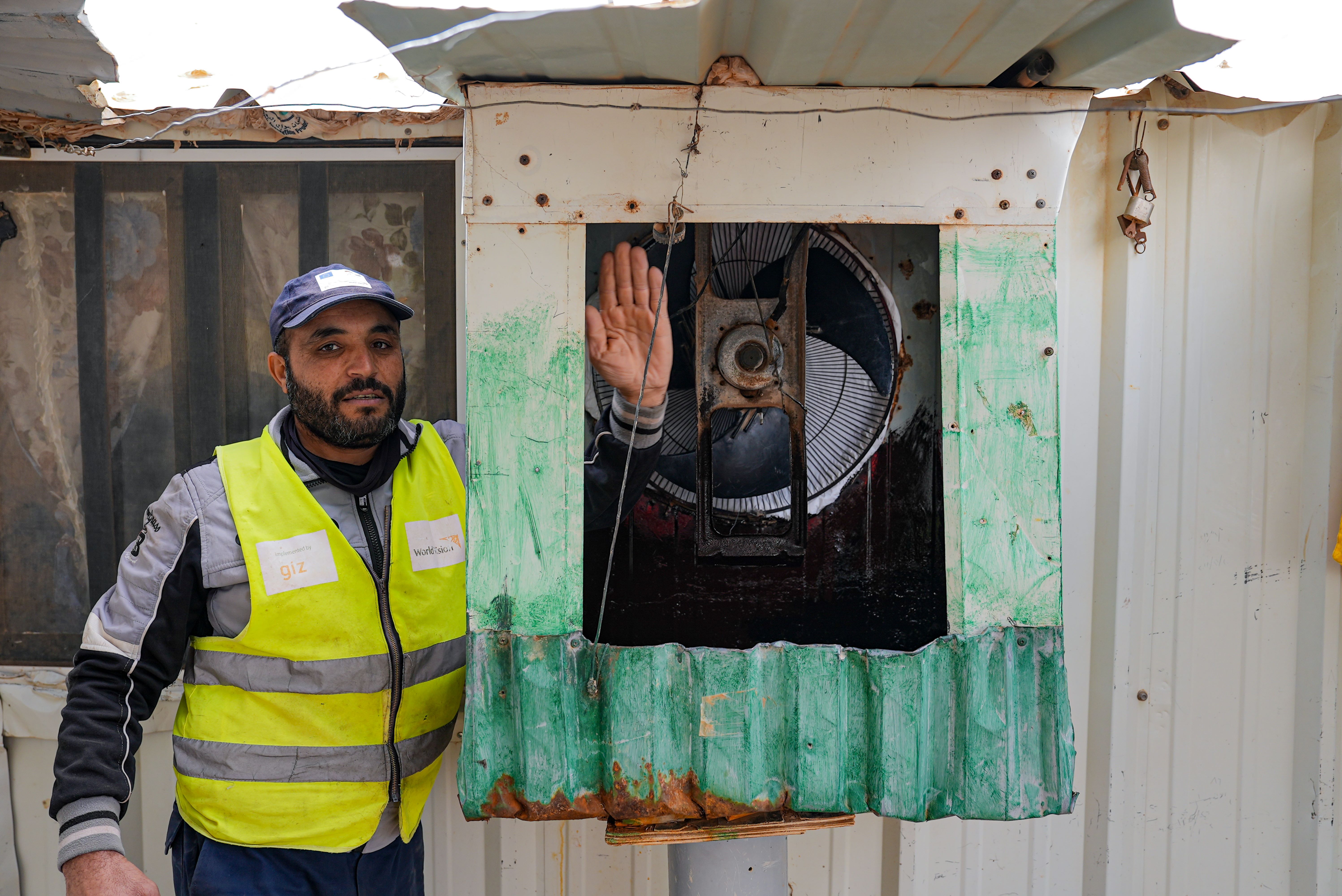 Mohsen showing the AC he installed in his house.