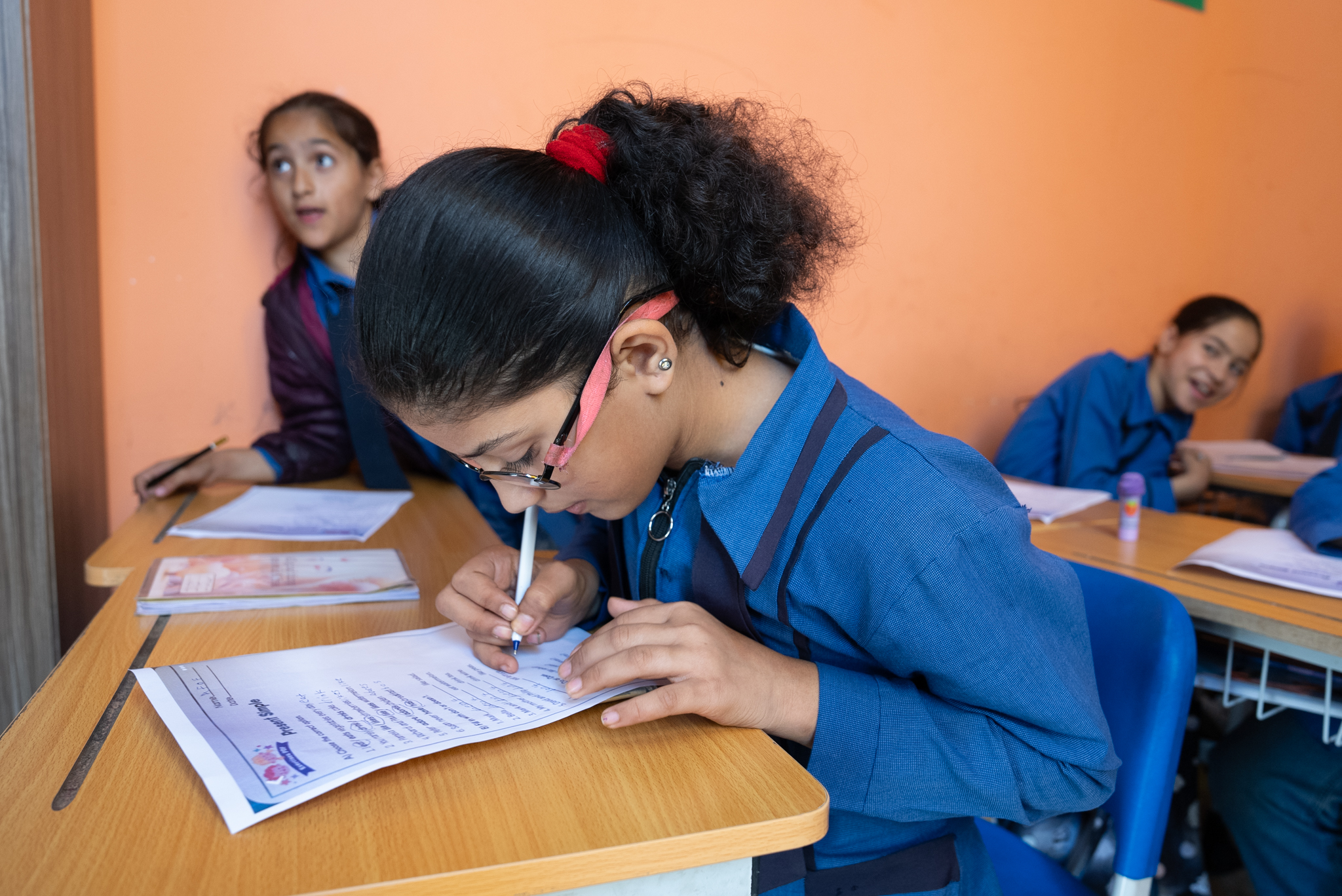 Dana solving an exercise during English Club World Vision Syria Response, Joanna Zreineh