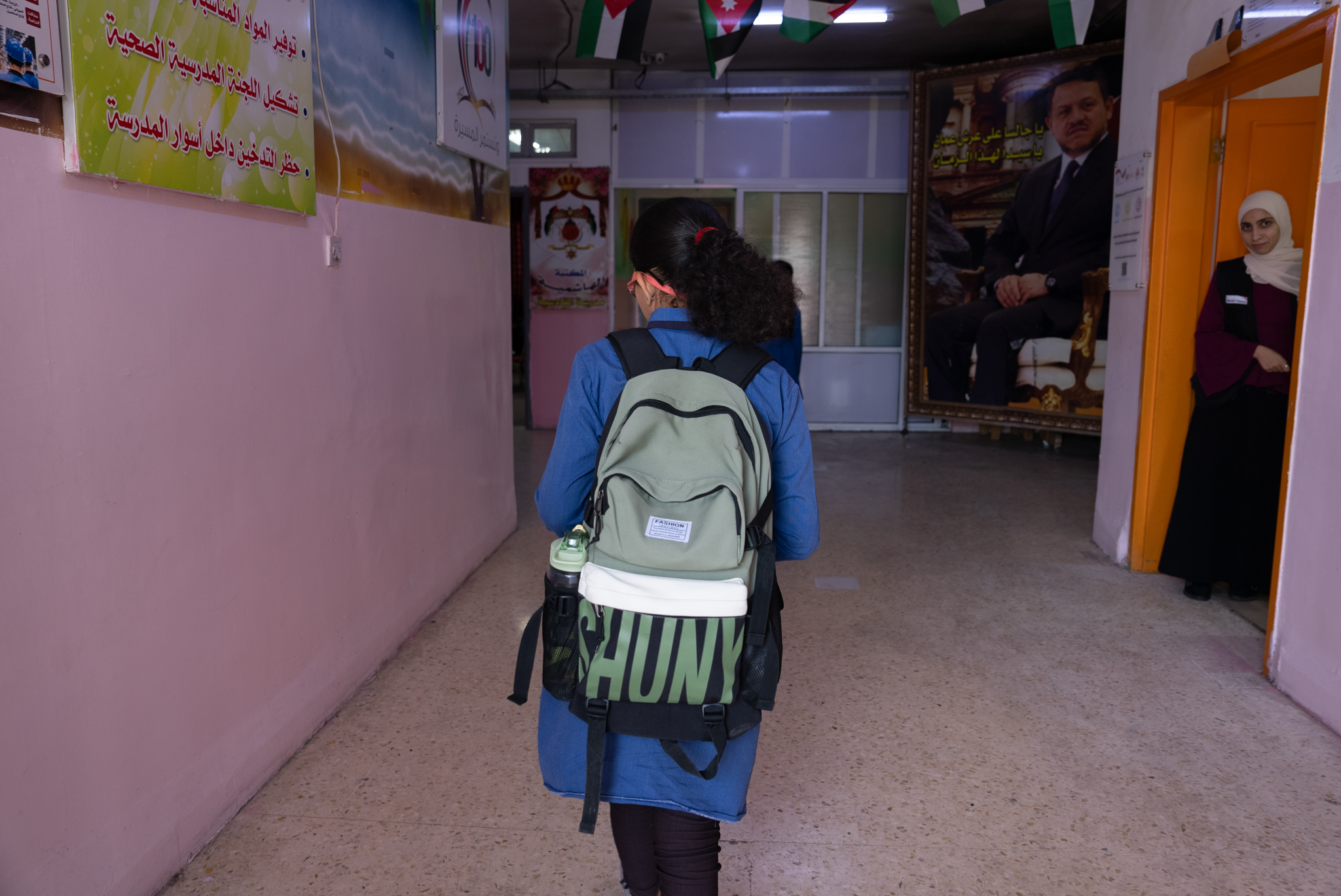 Dana* entering her school in Irbid. World Vision Syria Response, Joanna Zreineh