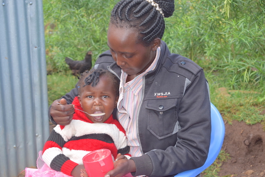 Sheryl, aged two, enjoys porridge made from millet flour fortified with edible insects.©World Vision Photo/Sarah Ooko.