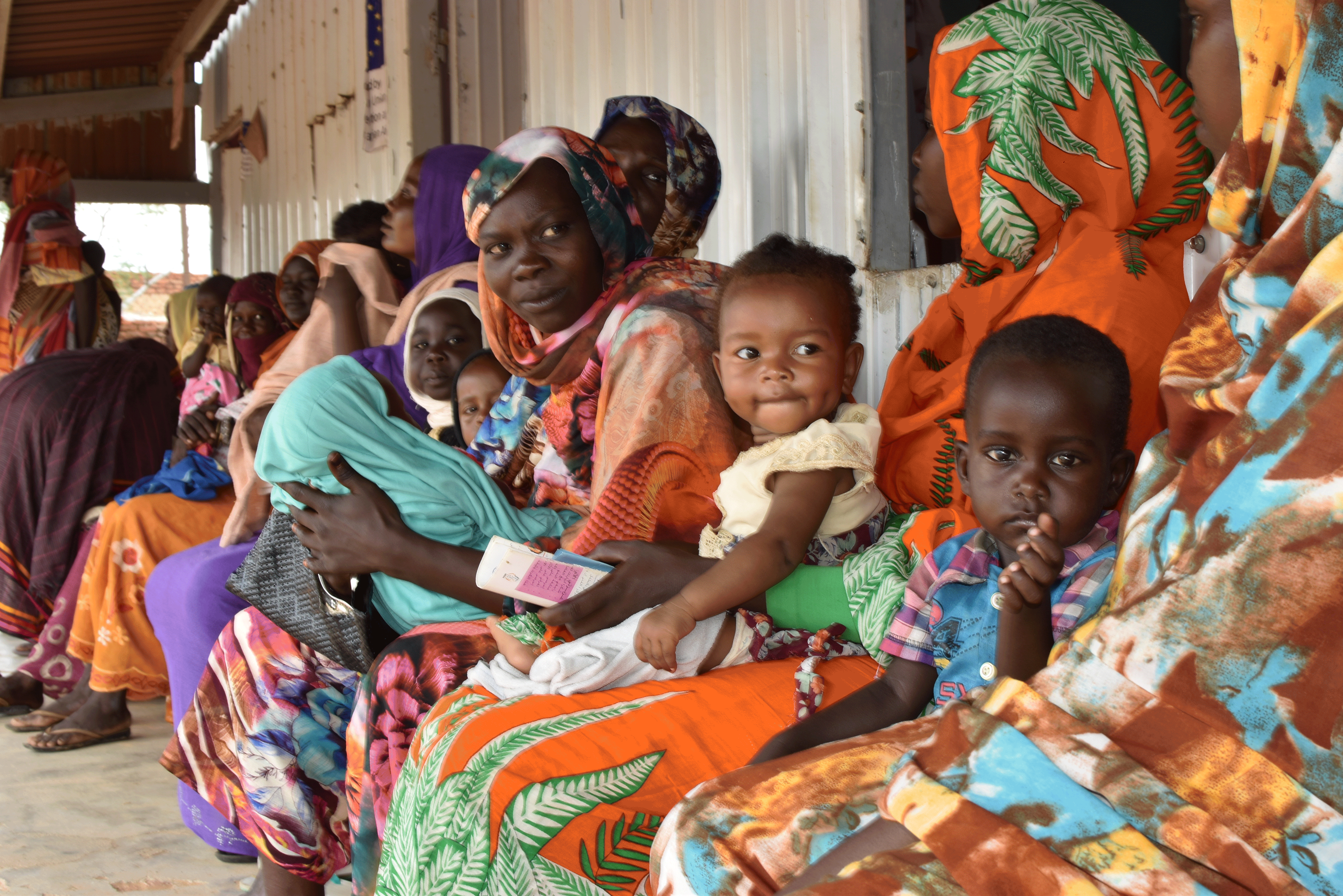 Mothers and their children wait to be attended to at the ECHO-funded Otash clinic in South Darfur.