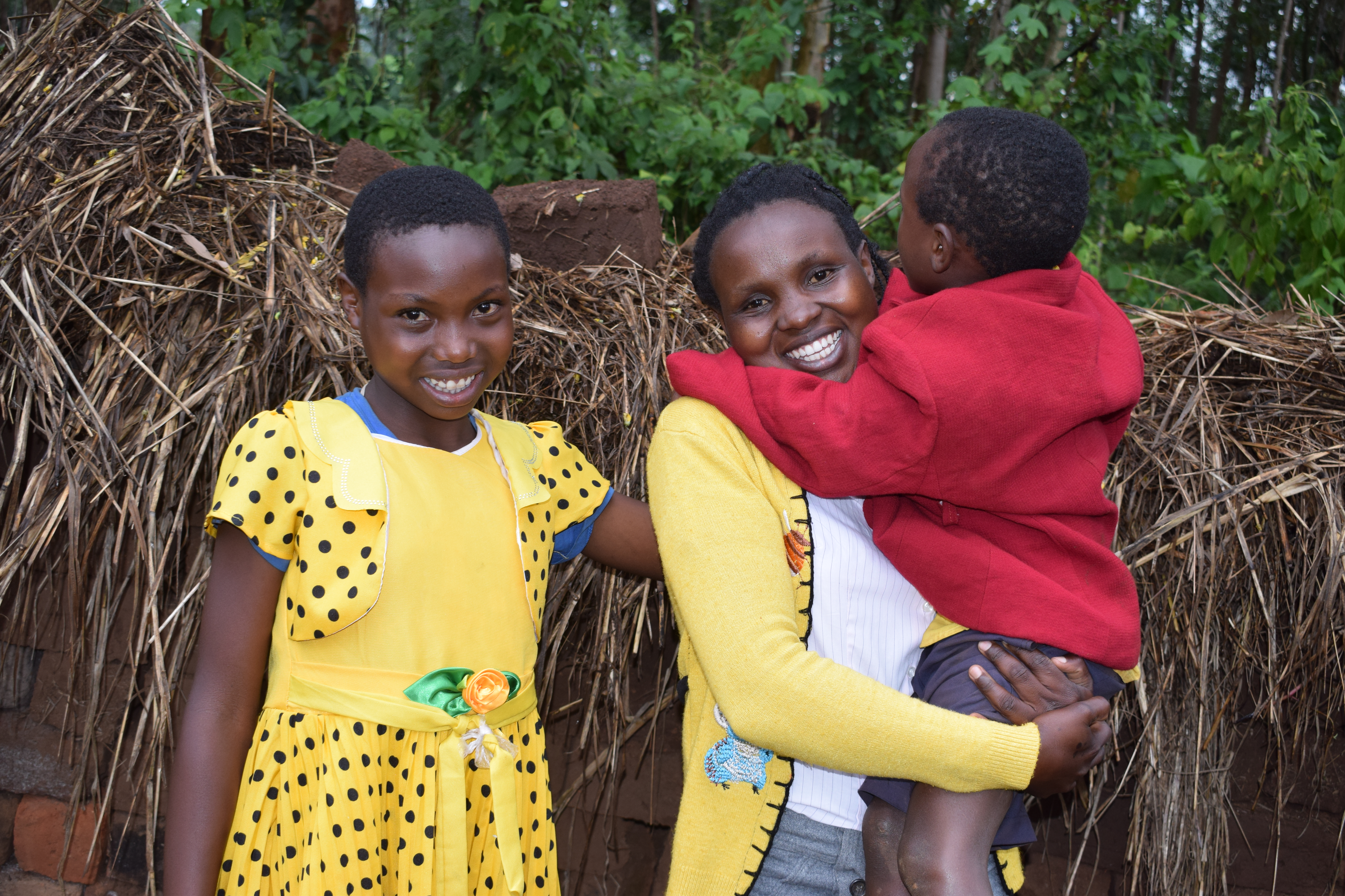 Right-Left: Annah (27) with her sister Cynthia (12) and Child Steven (7)at their home in Nyamusi, situated in Western Kenya. ©World Vision Photo/Sarah Ooko.