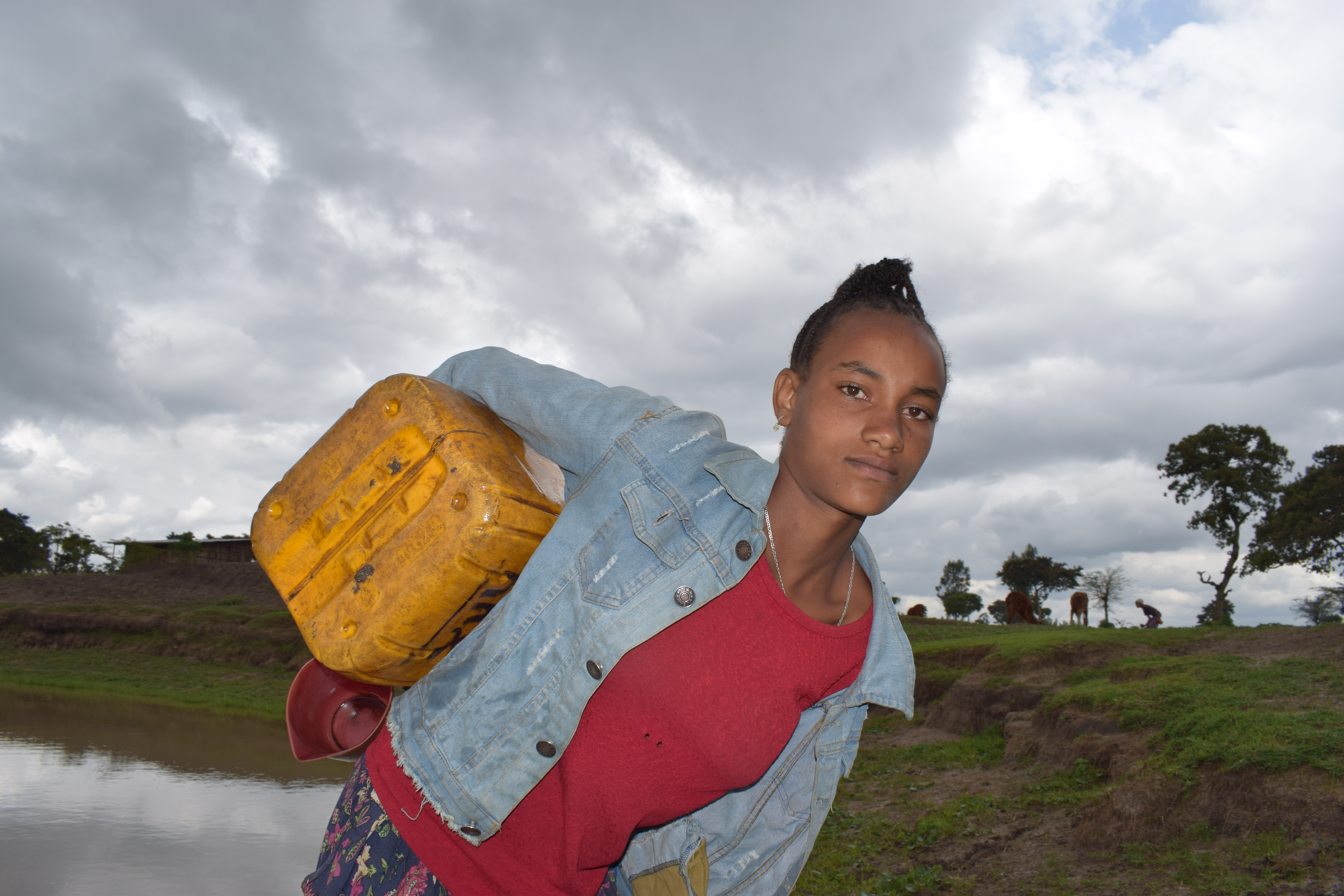 Bereket Carries jerry can full of water