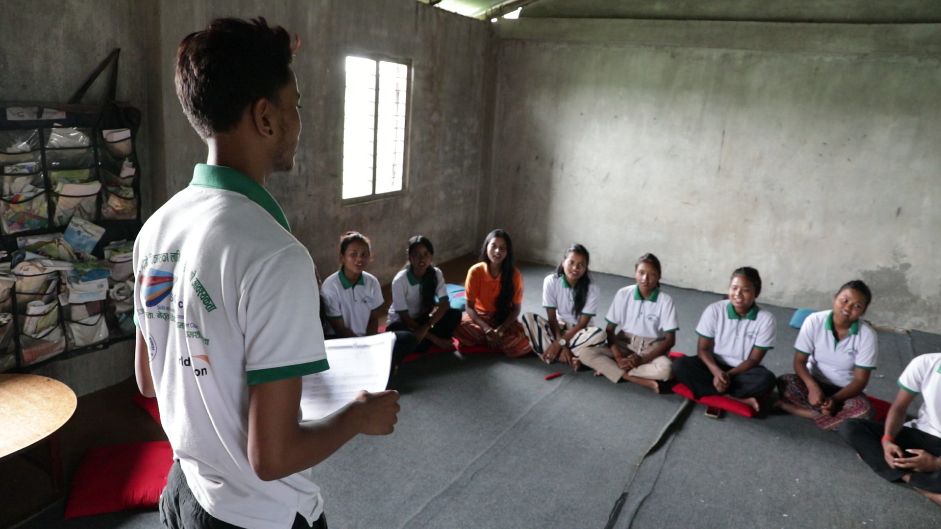 Chandan engaging SKYE club members in a discussion about community development activities