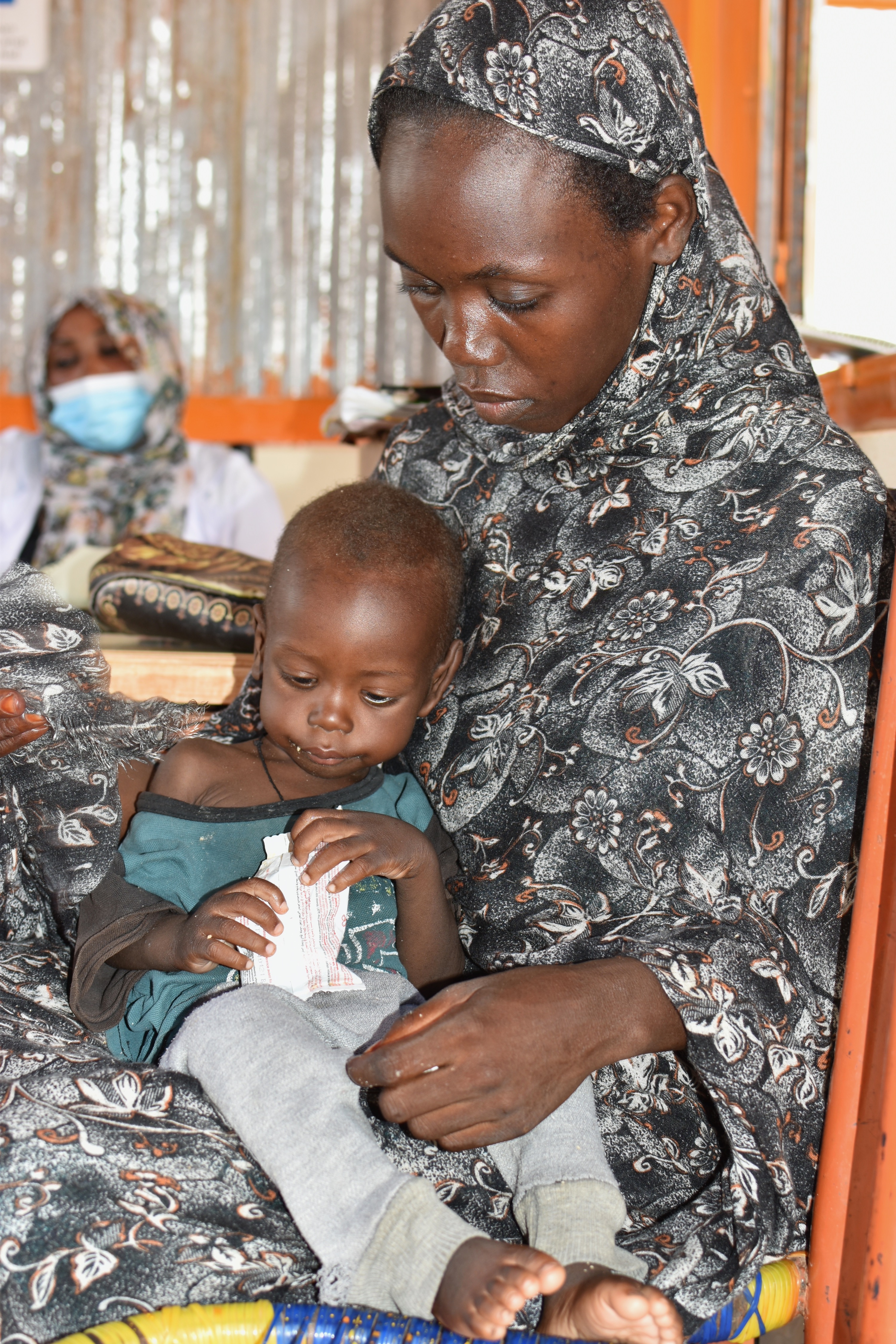 Mariam visiting the OTP centre in South Darfur. Her son Mohaned is going through rehabilitation for Severe Acute Malnutrition.