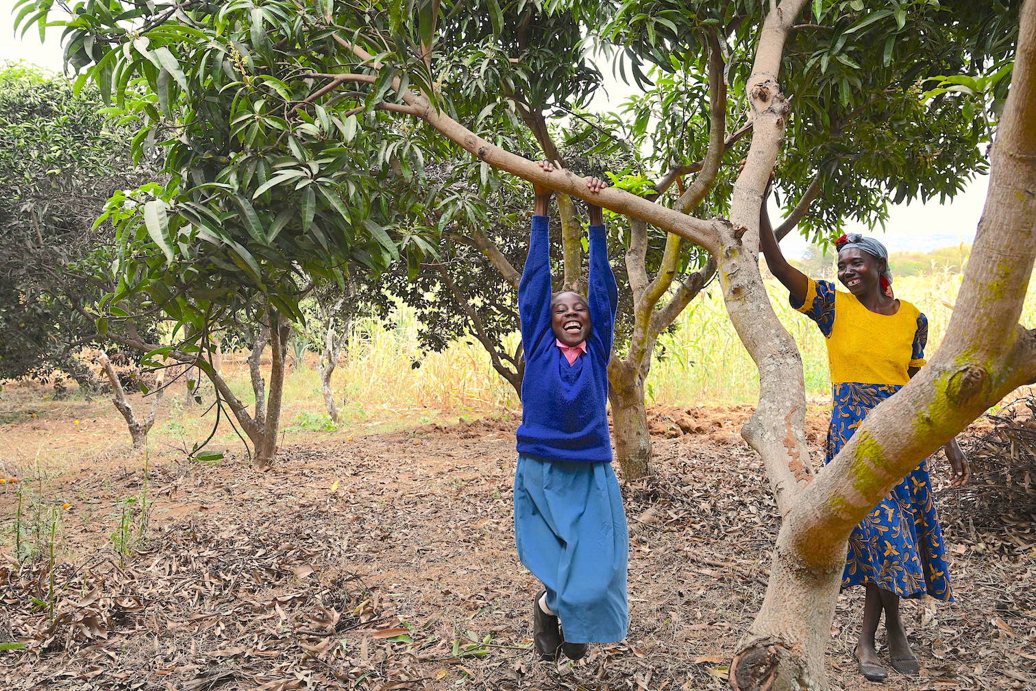 Thirteen-year-old Mercy enjoys playing under the shade of the numerous trees in their farm. ©World Vision Photo/Sarah Ooko.