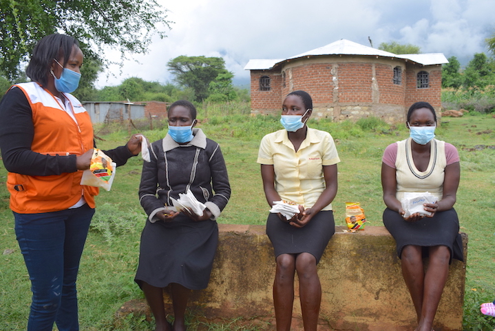 Women receiving the milled edible insects to use in the preparation of fortified porridge for their children in Elgeyo Marakwet County, Kenya. ©World Vision Photo/Sarah Ooko.