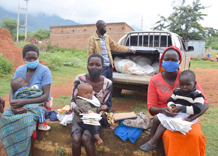 Mothers in holding milled edible insects, received through World Vision that they mix with millet flour and use to prepare fortified porridge for their children. ©World Vision Photo/Sarah Ooko. 