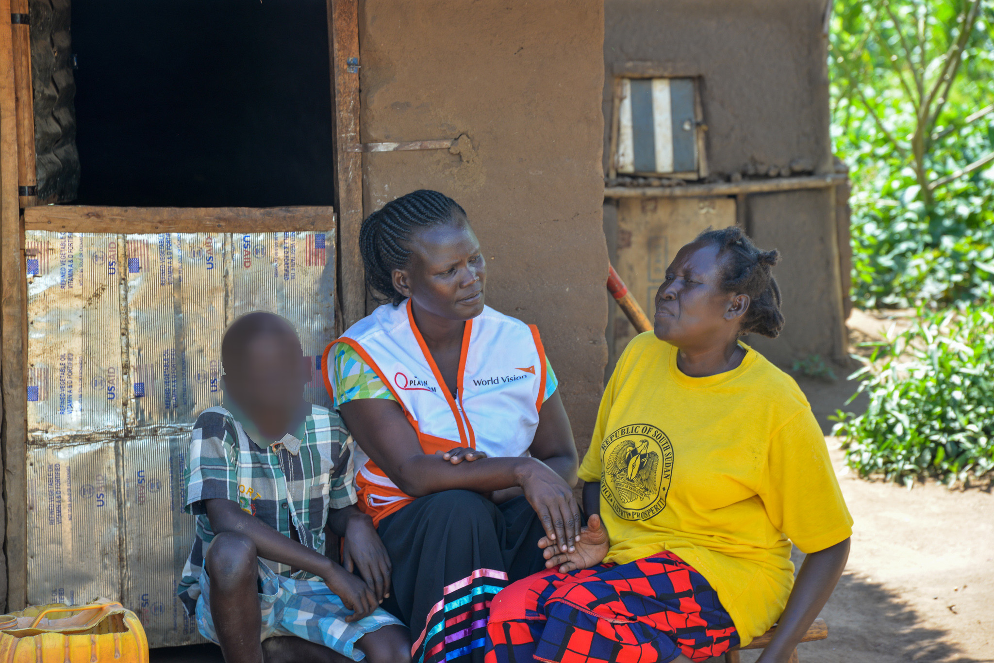 Joan with one of the children and his foster parent