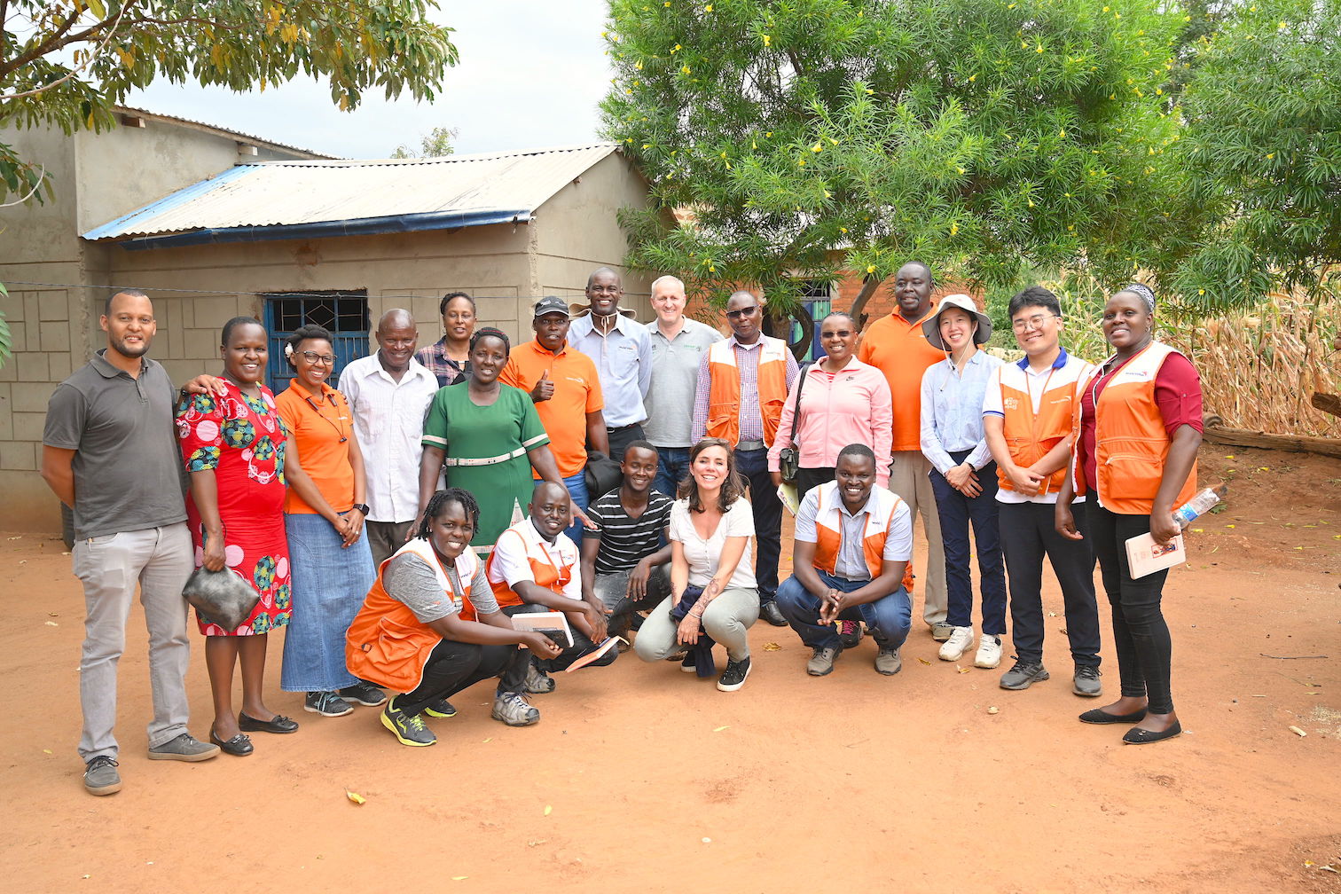 Felista's family with World Vision staff members that visited her home to gain more insights on her transformation journey. ©World Vision Photo/Sarah Ooko.