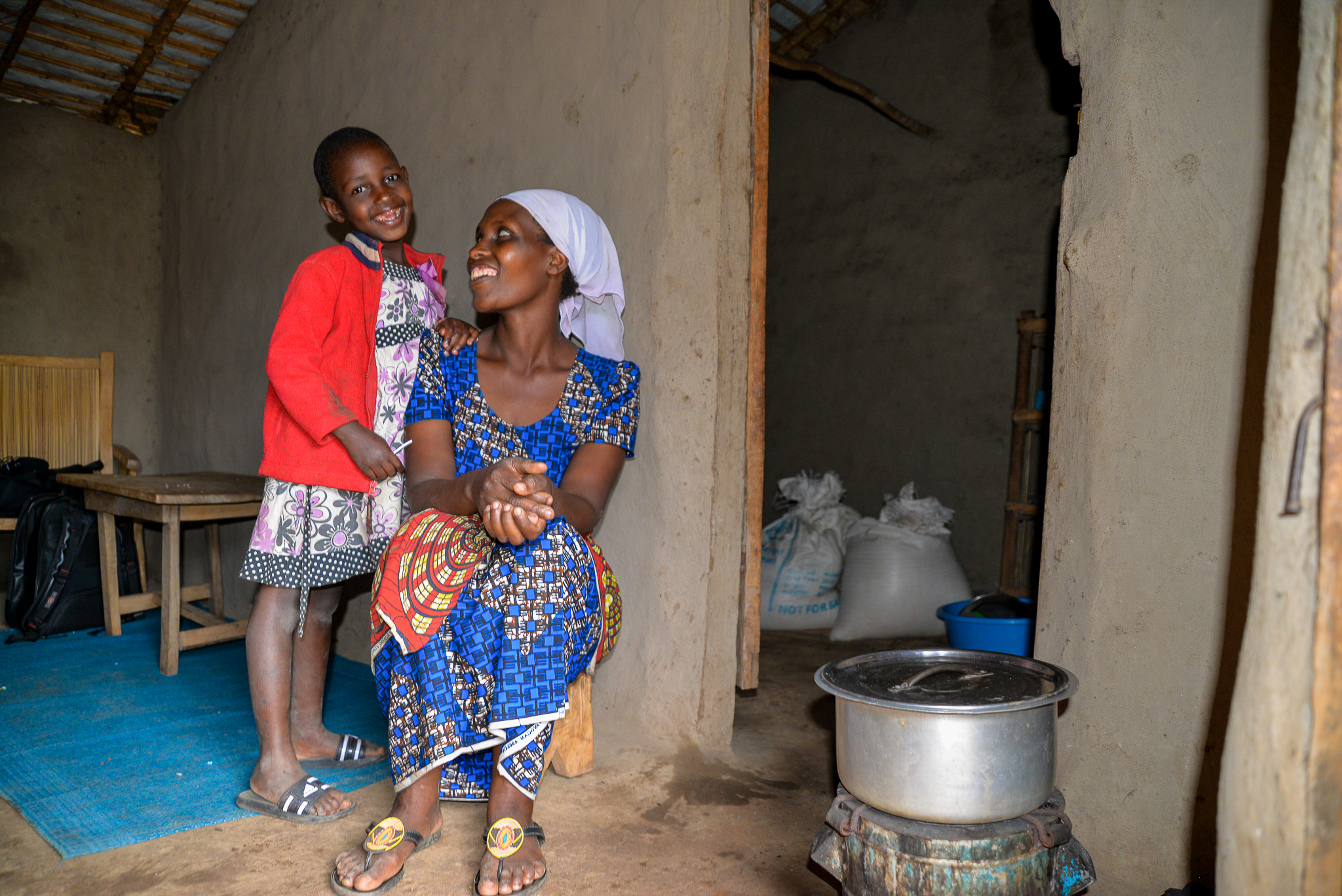 Bototo and her daughter Aline waiting for the food to cook