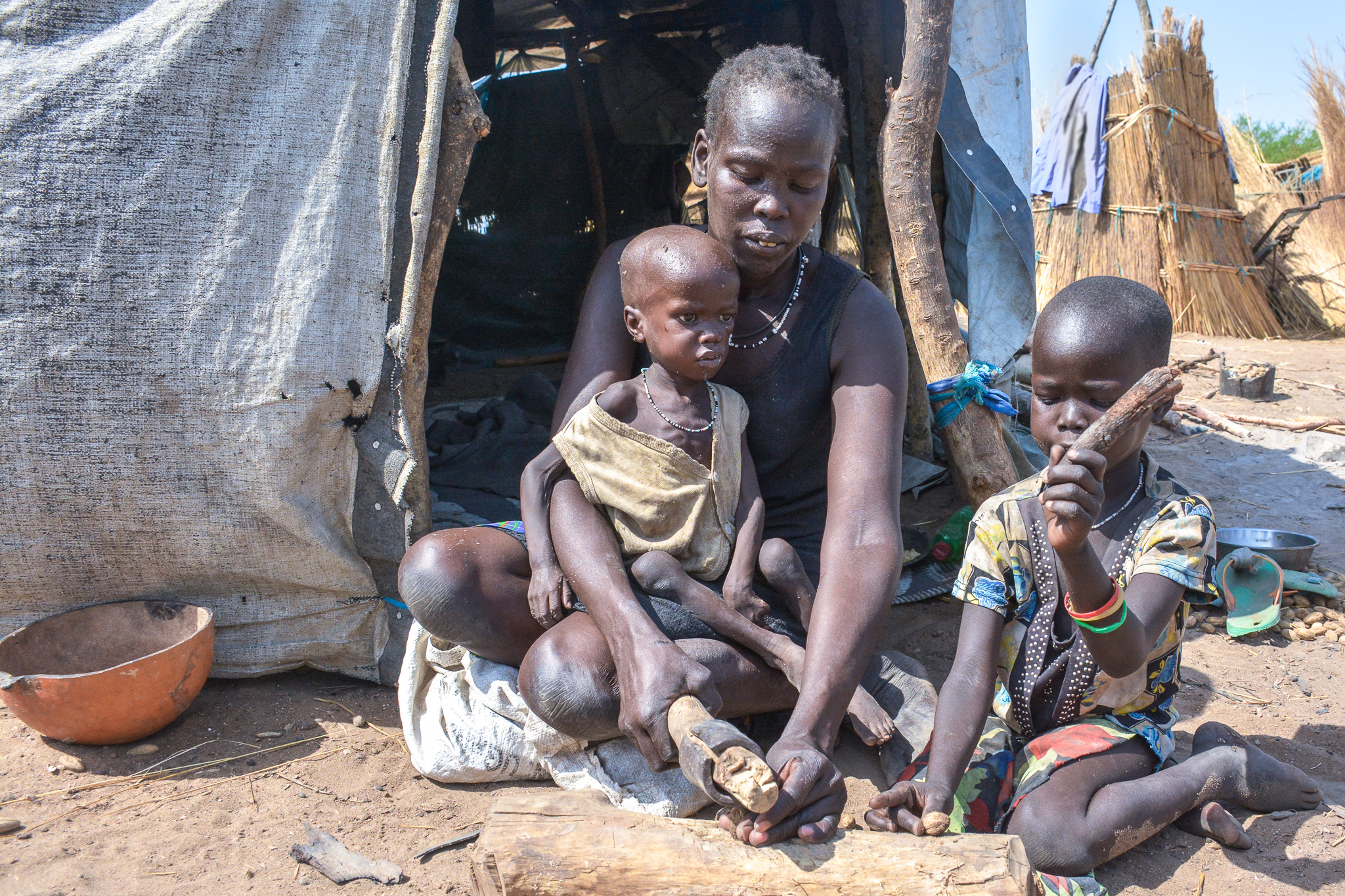 a family preparing the only meal for the day