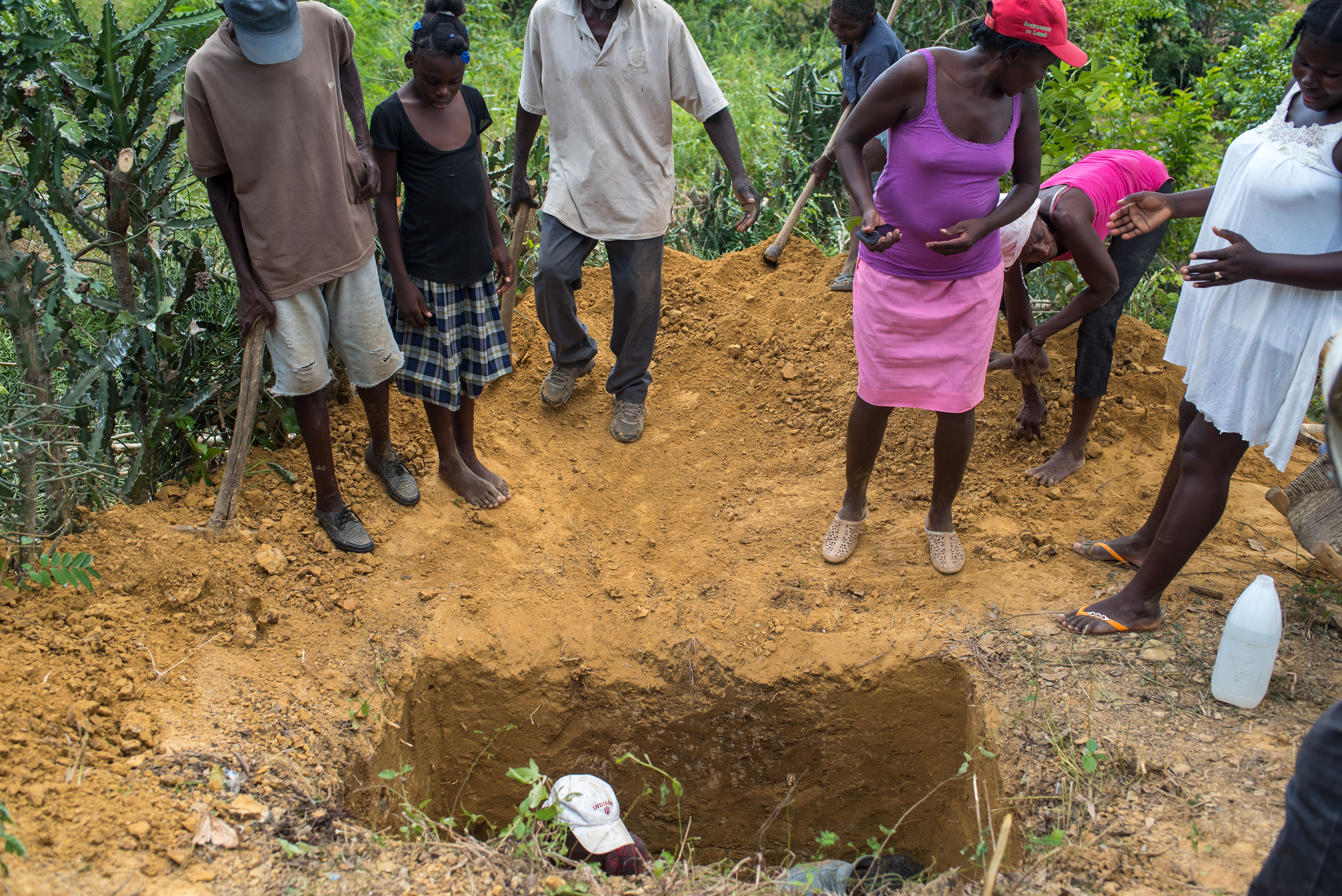 Community members working together to dig latrines