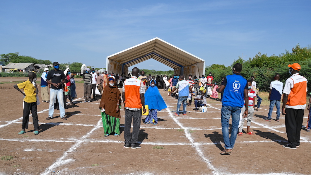 Refugees standing in queue as they wait to collect food at Kakuma Refugee Camp. ©World Vision Photo/Sarah Ooko.