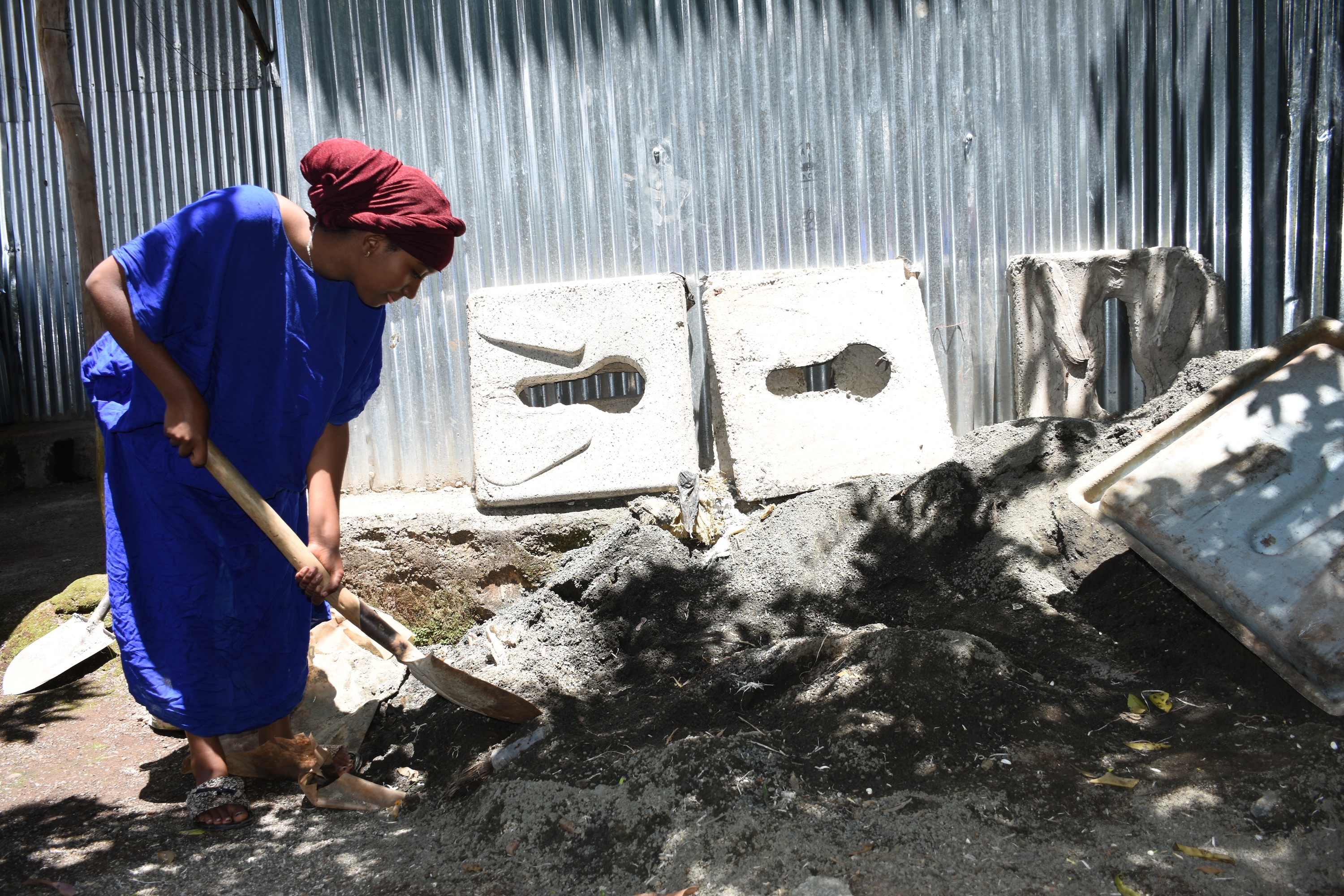 Siyam learning how to make slabs from her mother