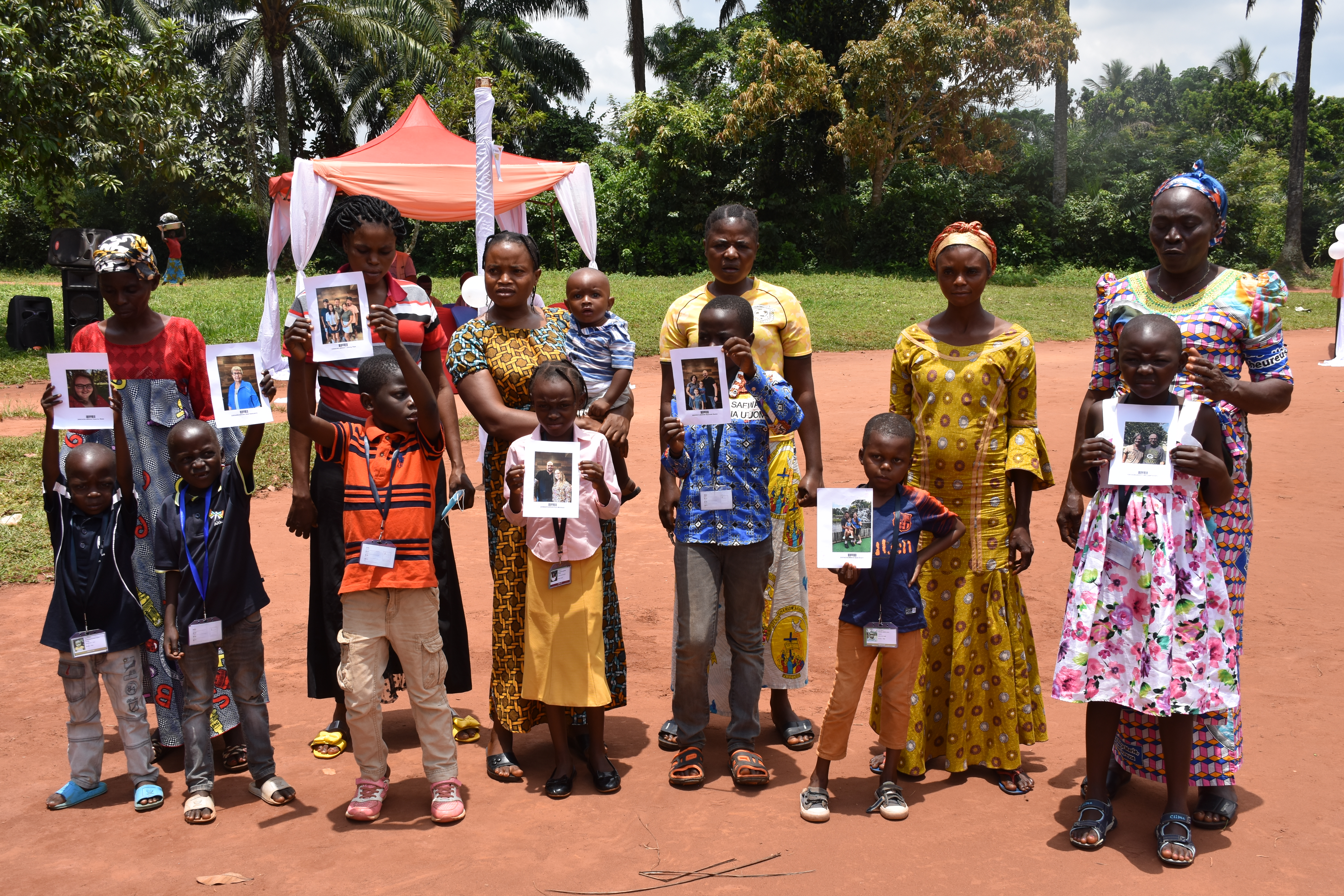 Sponsored children with their parents after Chosen event
