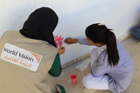 Staff member of World Vision Jerusalem – West Bank – Gaza (JWG) during a psychosocial support activity