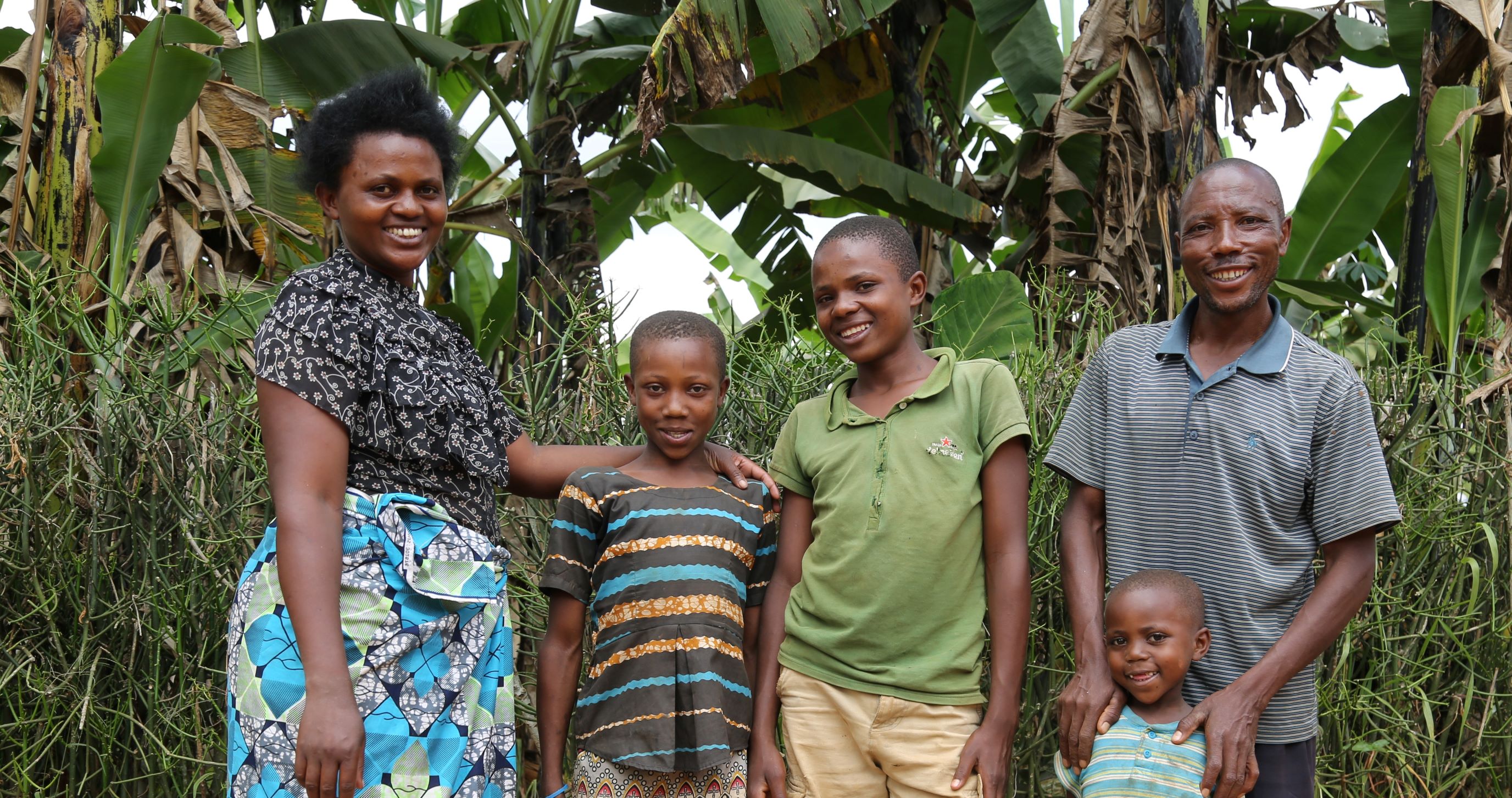 Diogene and his family happily pose for a photo.jpeg