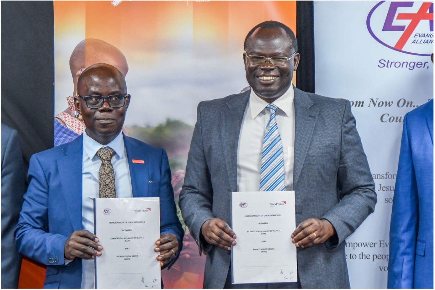 World Vision Kenya National Director Gilbert Kamanga (left) and EAK Board Vice-chairperson Dr. Robert Langat (right) present the newly signed Memorandum of Understanding. © World Vision Photo | Samuel Kisambe