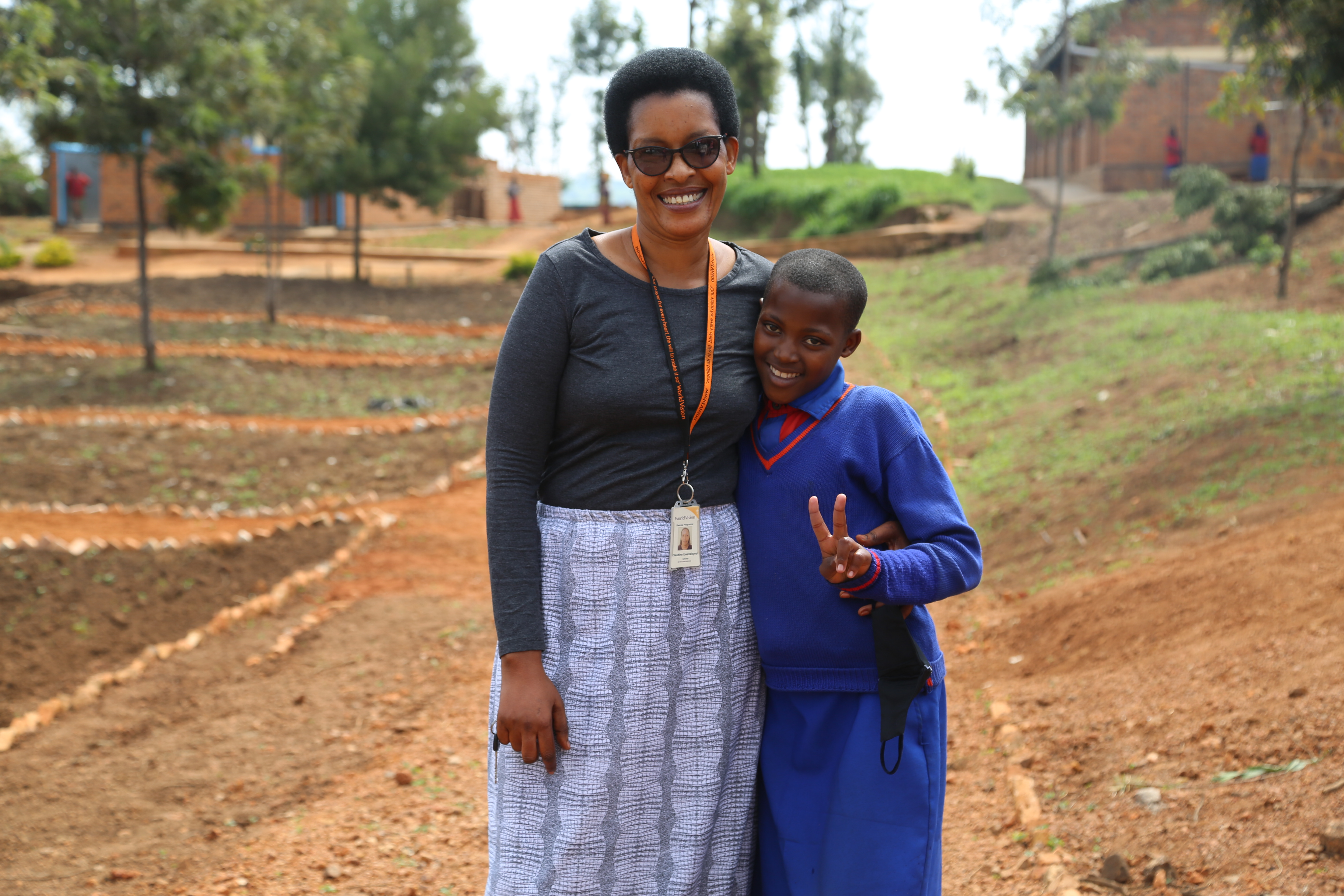 Claudine World Vision's female driver  with Cynthia, a child from Gicumbi district.