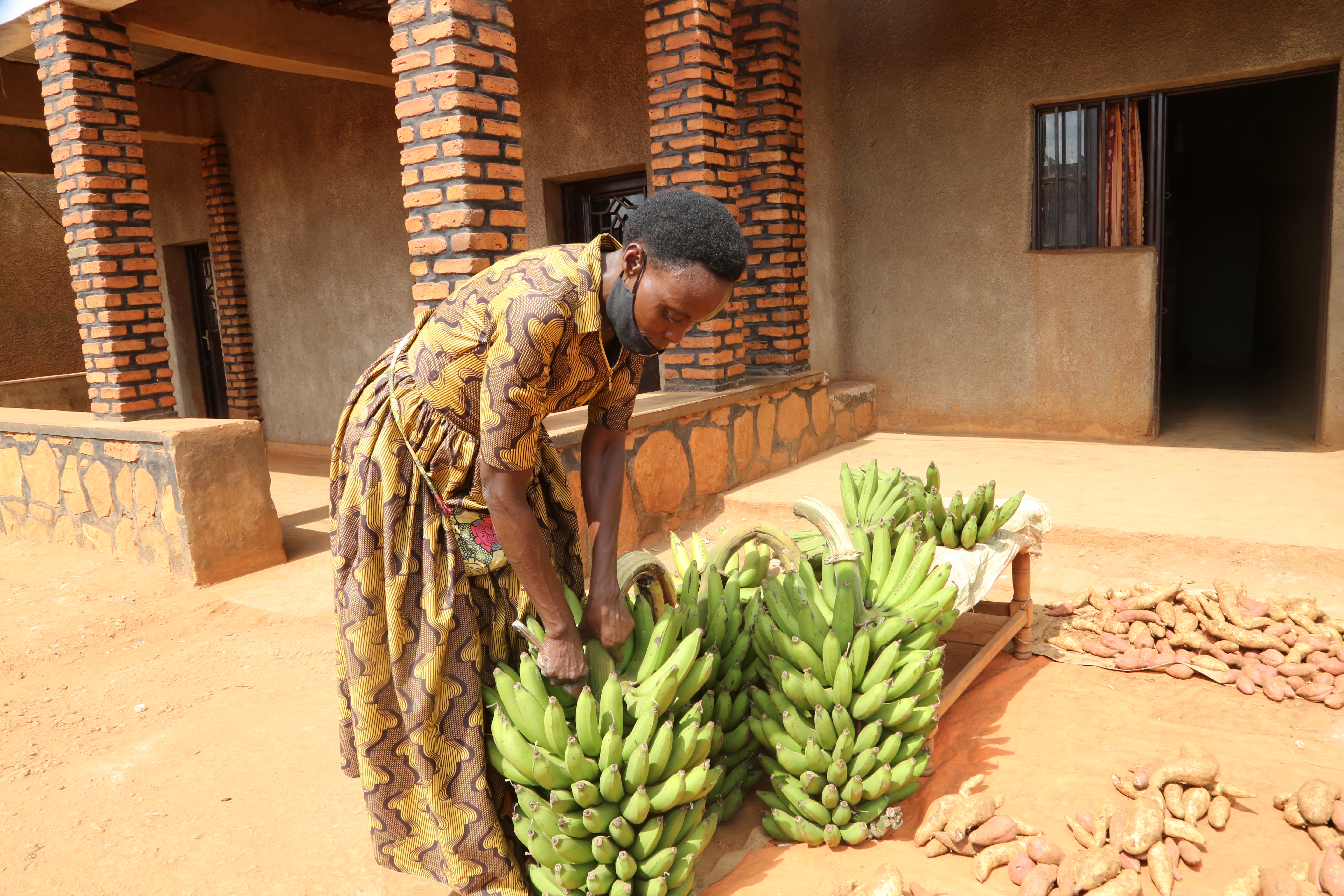 Immaculee prepares bananas for an order received from a customer