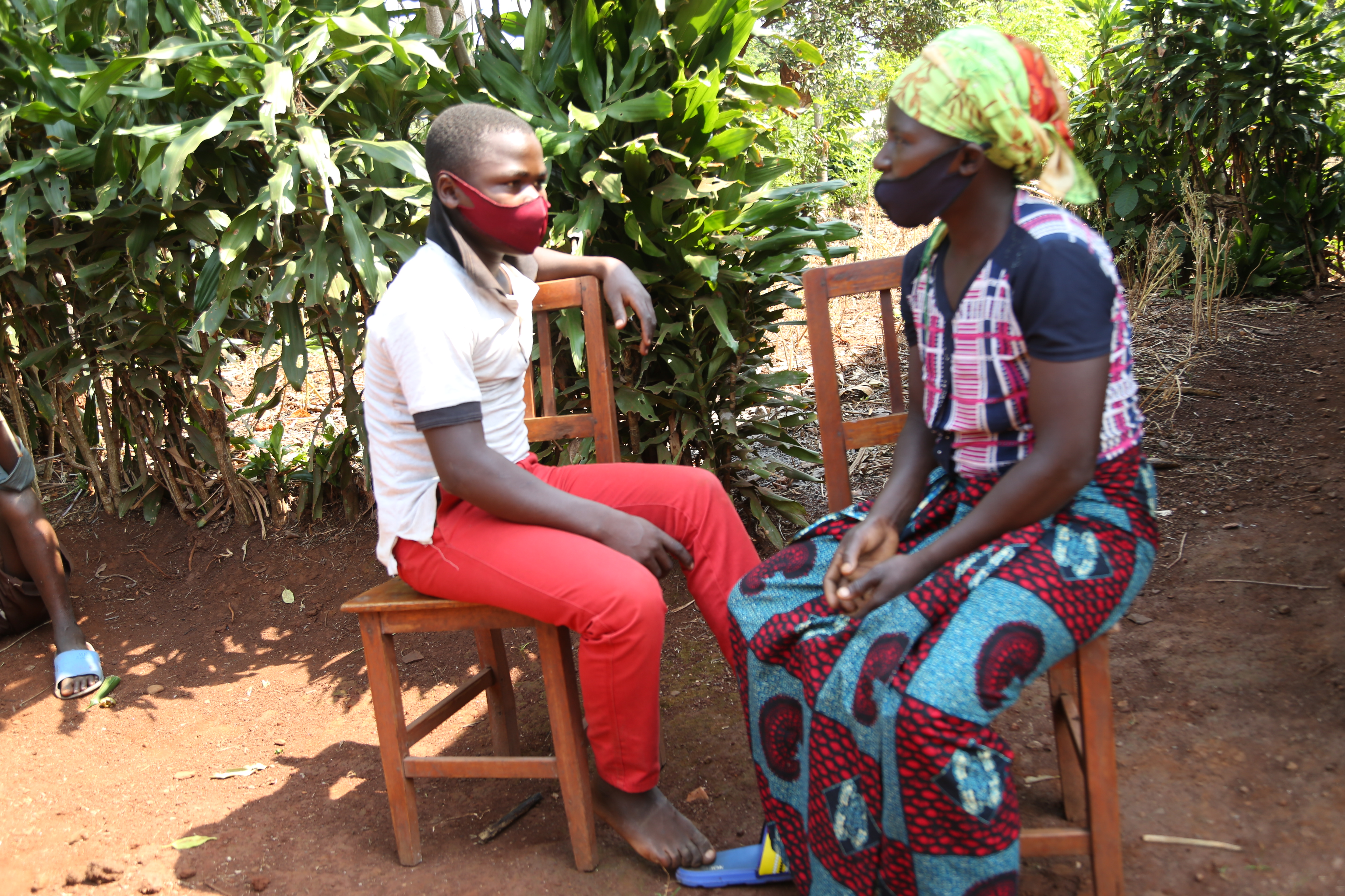 Dieudonne chatting with his mother at home