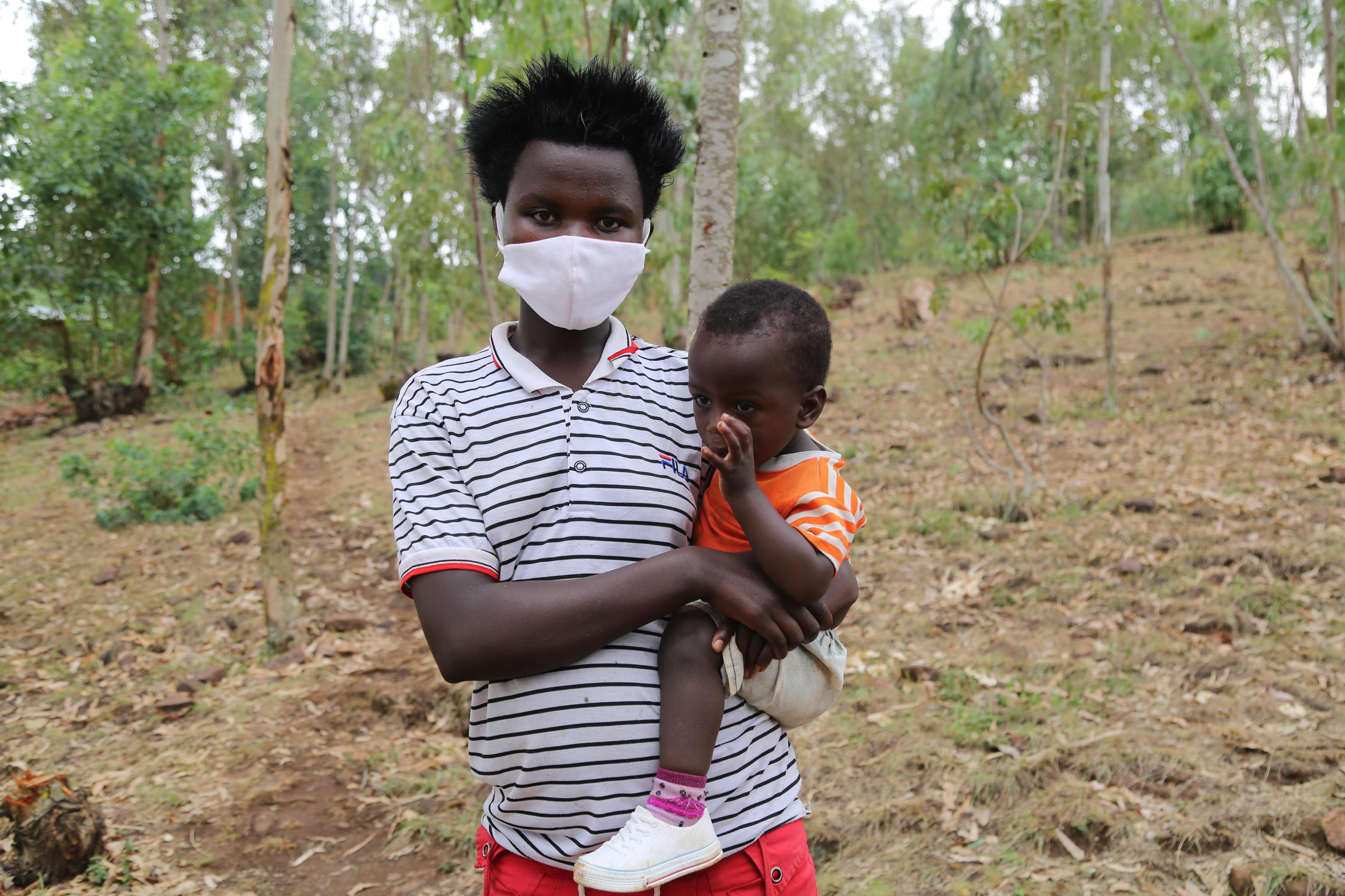 Jeanette With her baby after benefiting from the saving group.