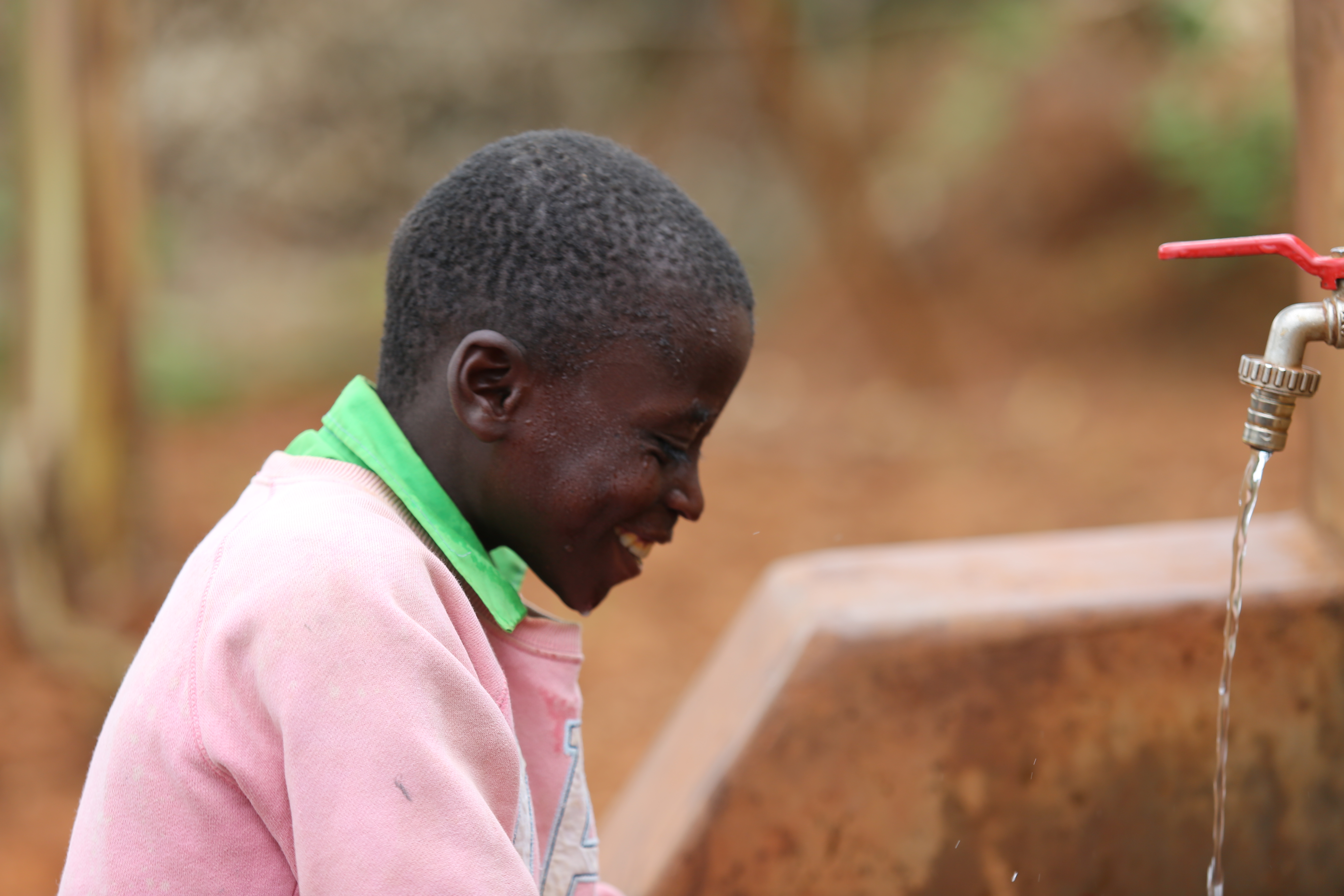 Emmanuel filled with joy as he fetches clean water