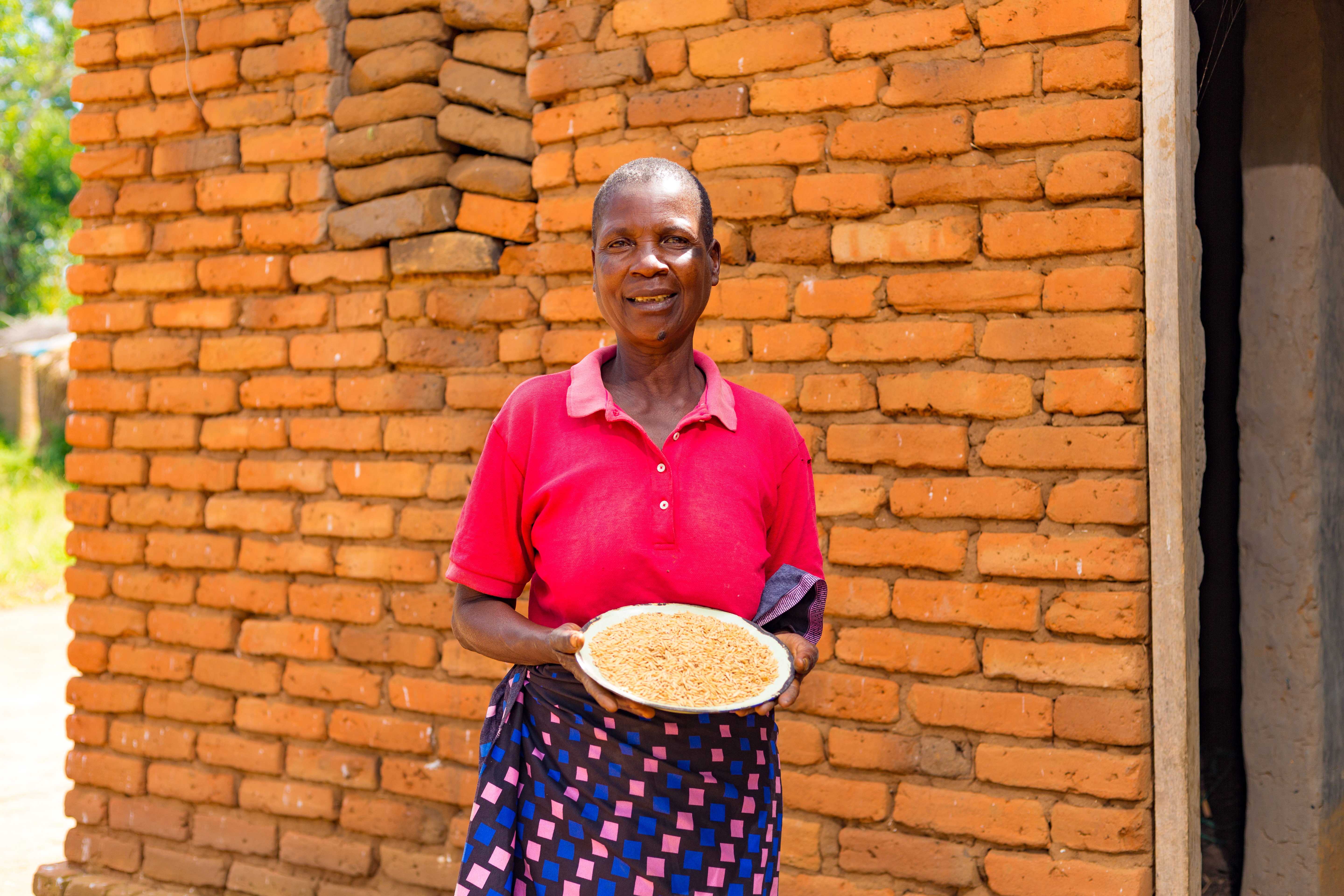 Ezeria Nachimate, a proud rice farmer and a member of Tikondane Club.