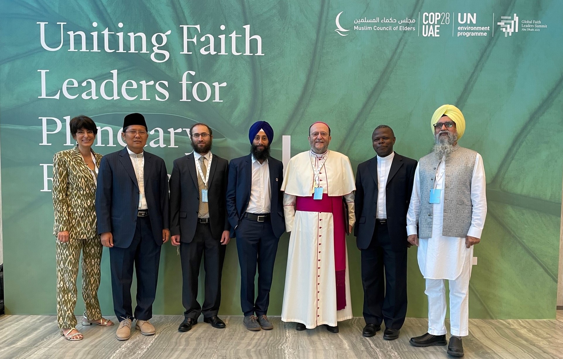 Charlotte Masiello-Riome, Senior Advisor Communications & External Engagement (left) joins Doctor Mohamed Cholil Nafis, President of the Indonesian Ulema Council (second from left), Bishop Paolo Martinelli of the Apostolic Vicariate of Southern Arabia (center) and other delegates.