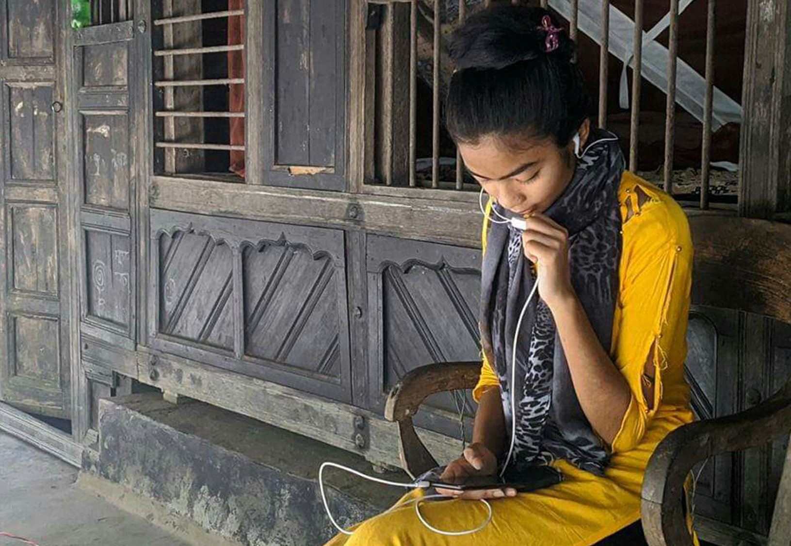 Farzana is having conversation through digital technology to disseminate message to her community