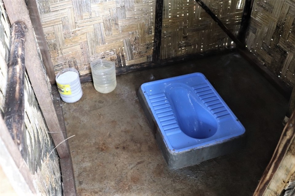 Inside one of the toilets in plastic compound. The community through self-reliance contributed funds towards purchase of Portland cement used for the concrete slabs and other hardware materials.