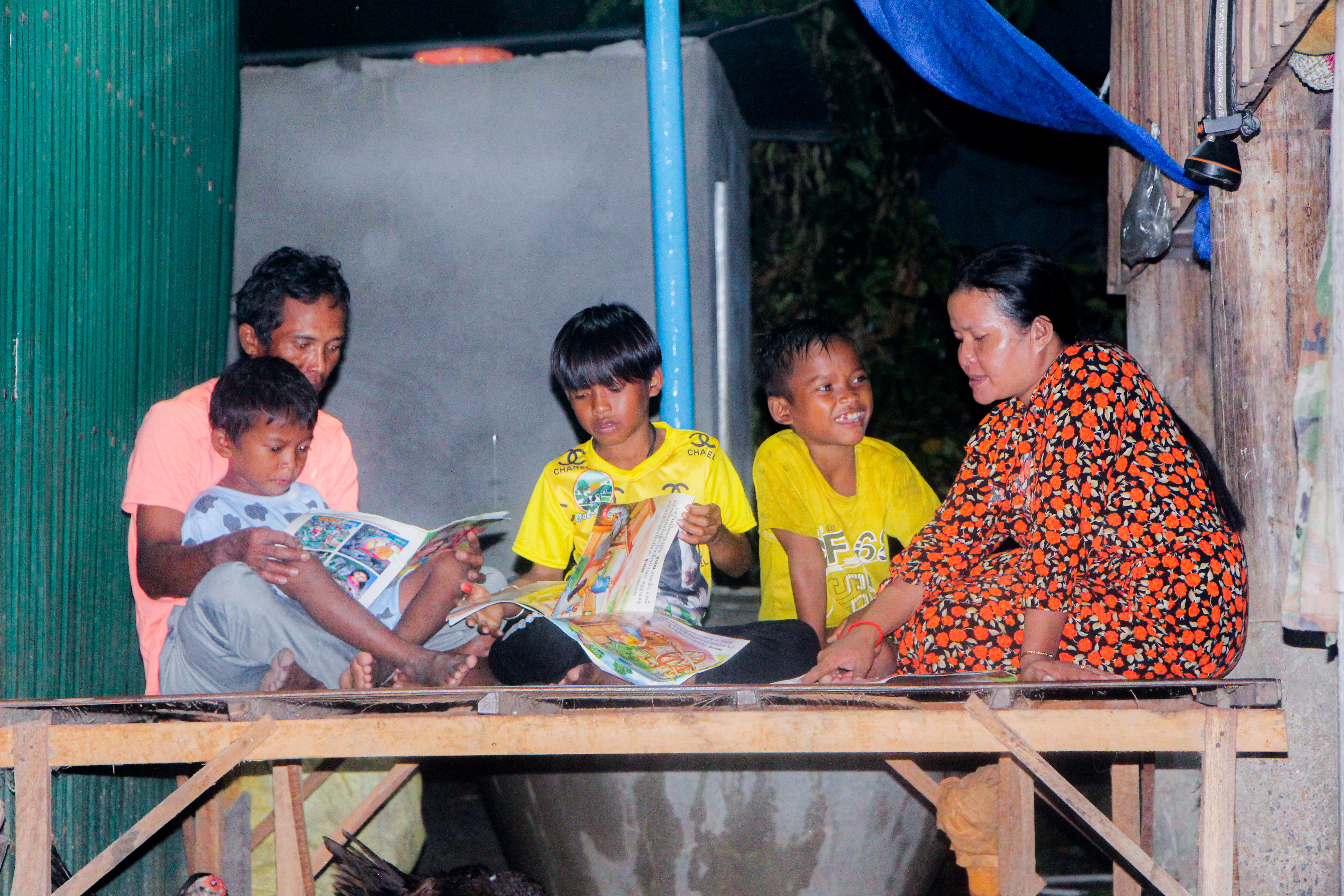 Makara's reading the books for his aunt. 
