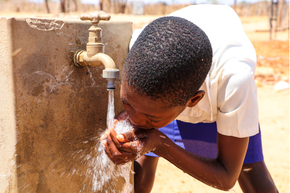Sharmaine drinking water from the tap