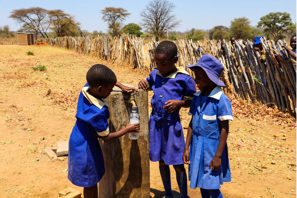 Children fetching clean water from a newly installed tap