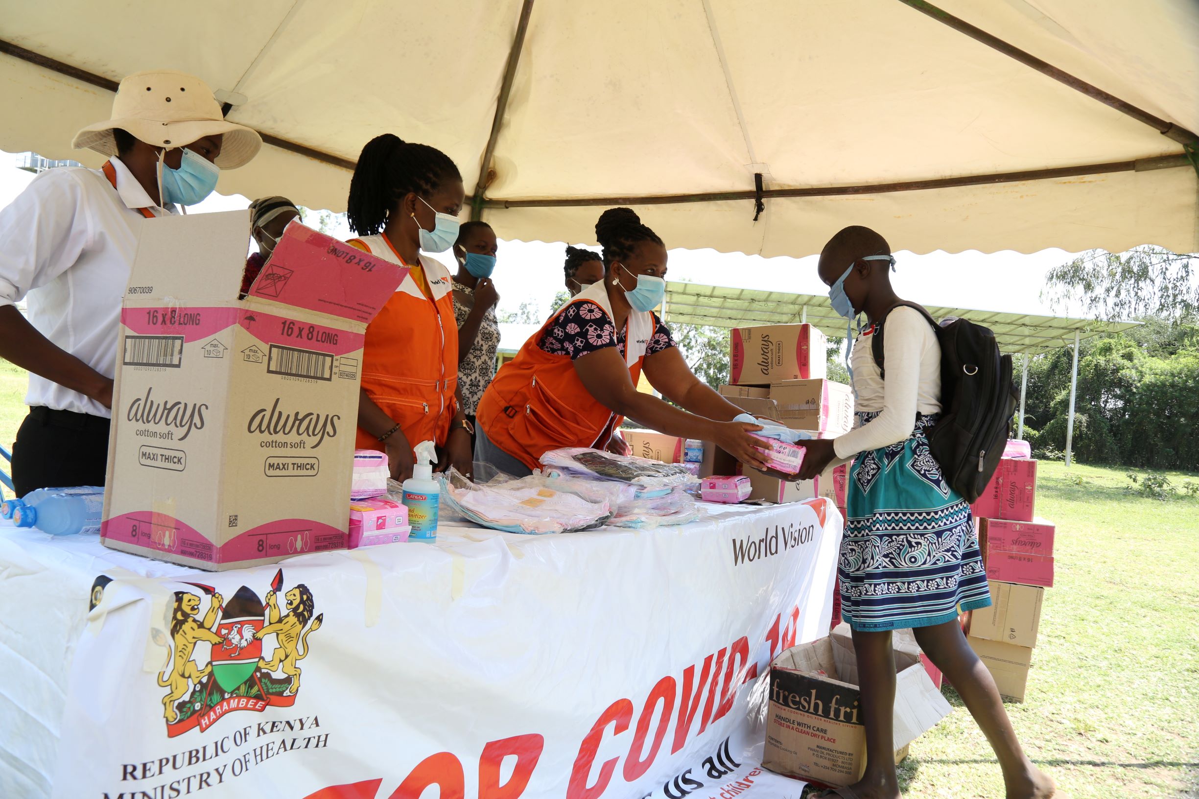 Girls receiving sanitary pads in Katito AP Kenya