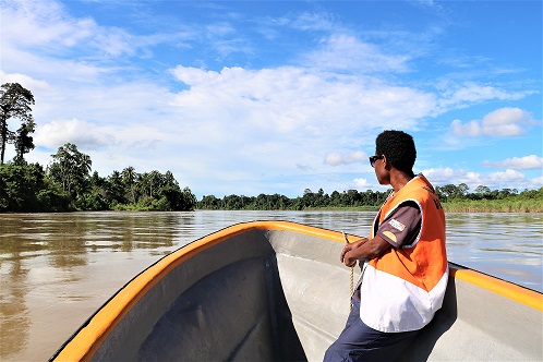 Erinol on a her transport to work each day, a fiberglass dinghy powered by an outboard motor.