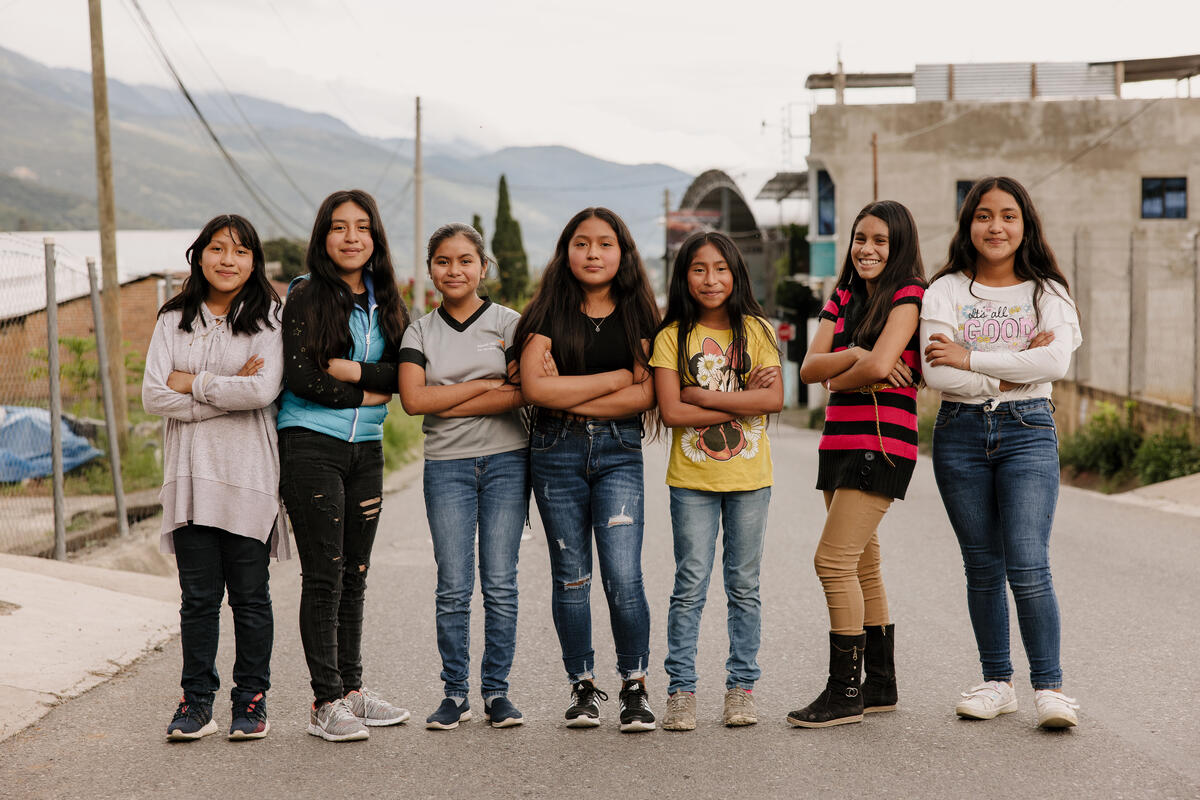 Adolescent Girls from a teen club in Honduras stand in a line.