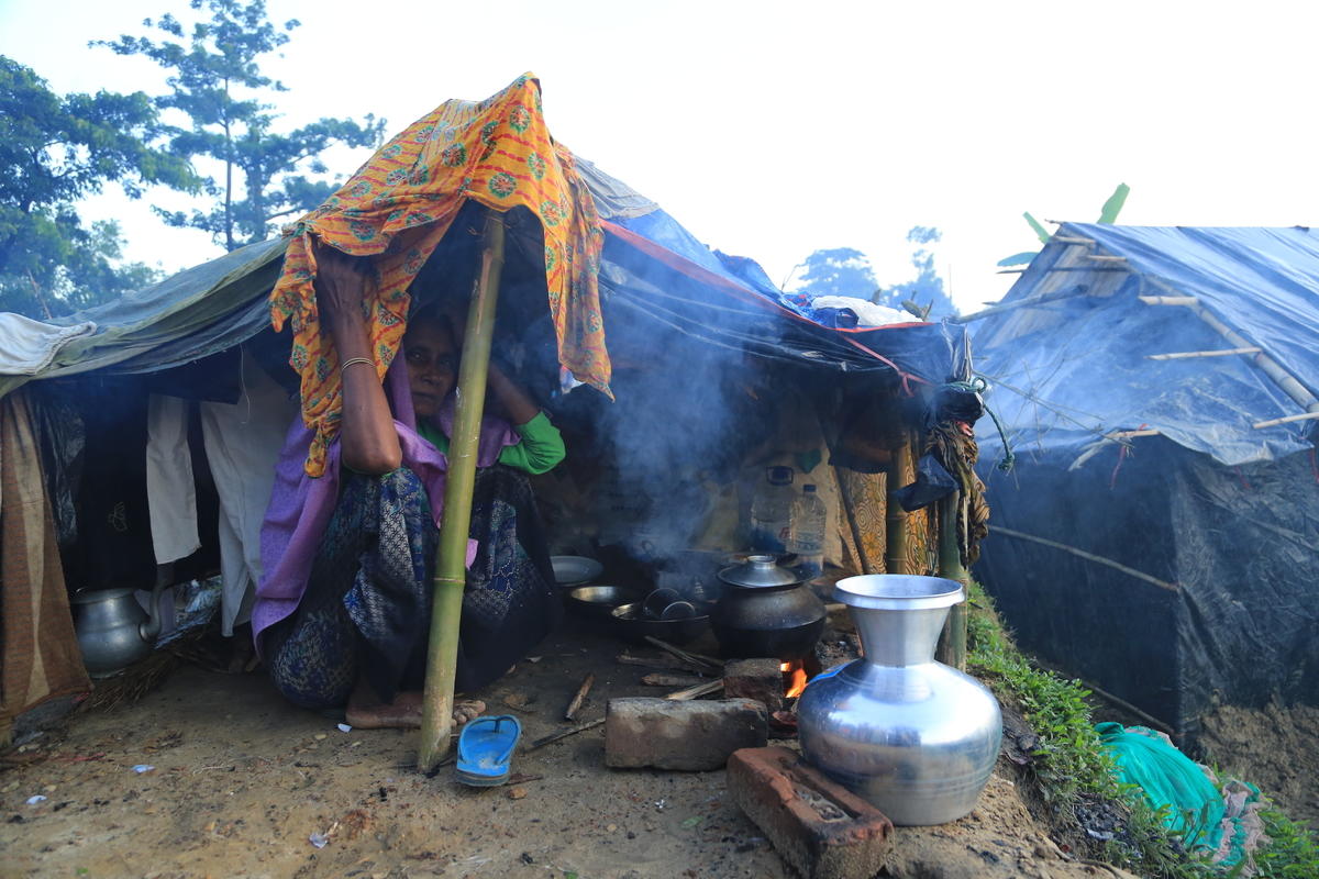 Women tried to be strong for their families as they set up shelters in the camps.