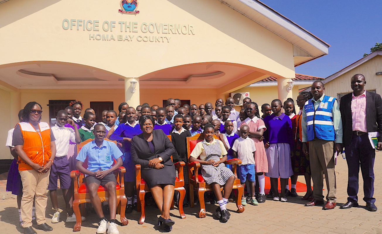 Governor Glady Wanga with children, county officials, World Vision staff, among other partners working in the child protection field. ©World Vision Photo/Felix Pilipili.