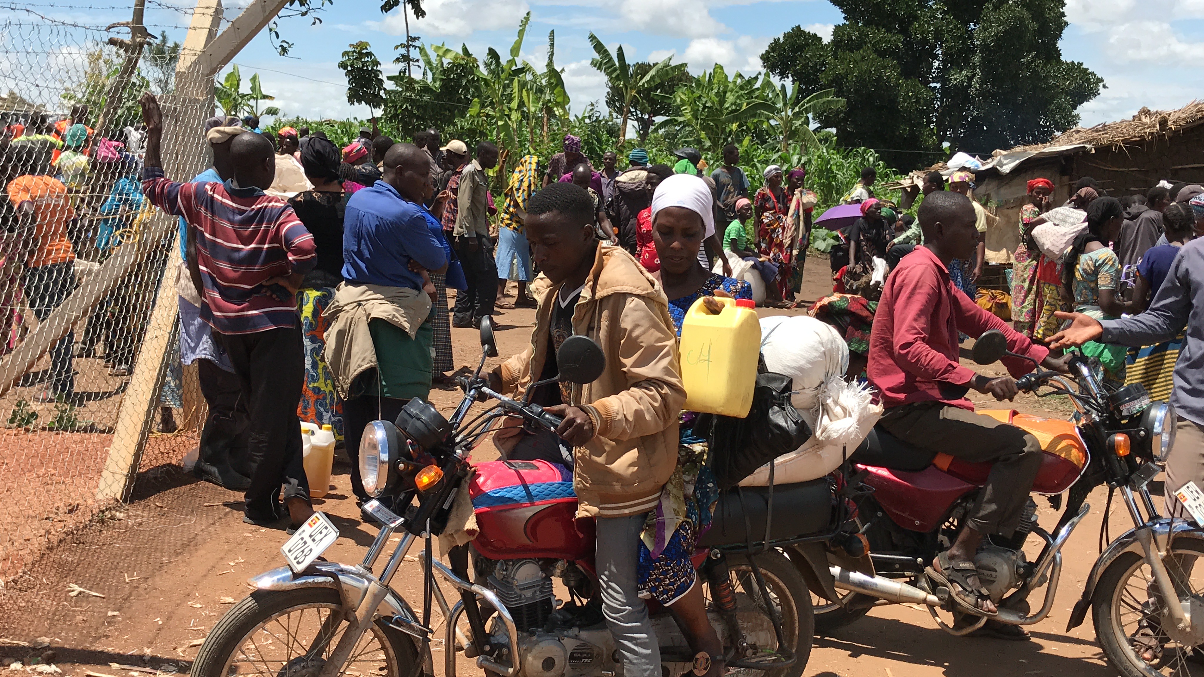 Butoto getting ready to move back home on a bodaboda motorcycle.