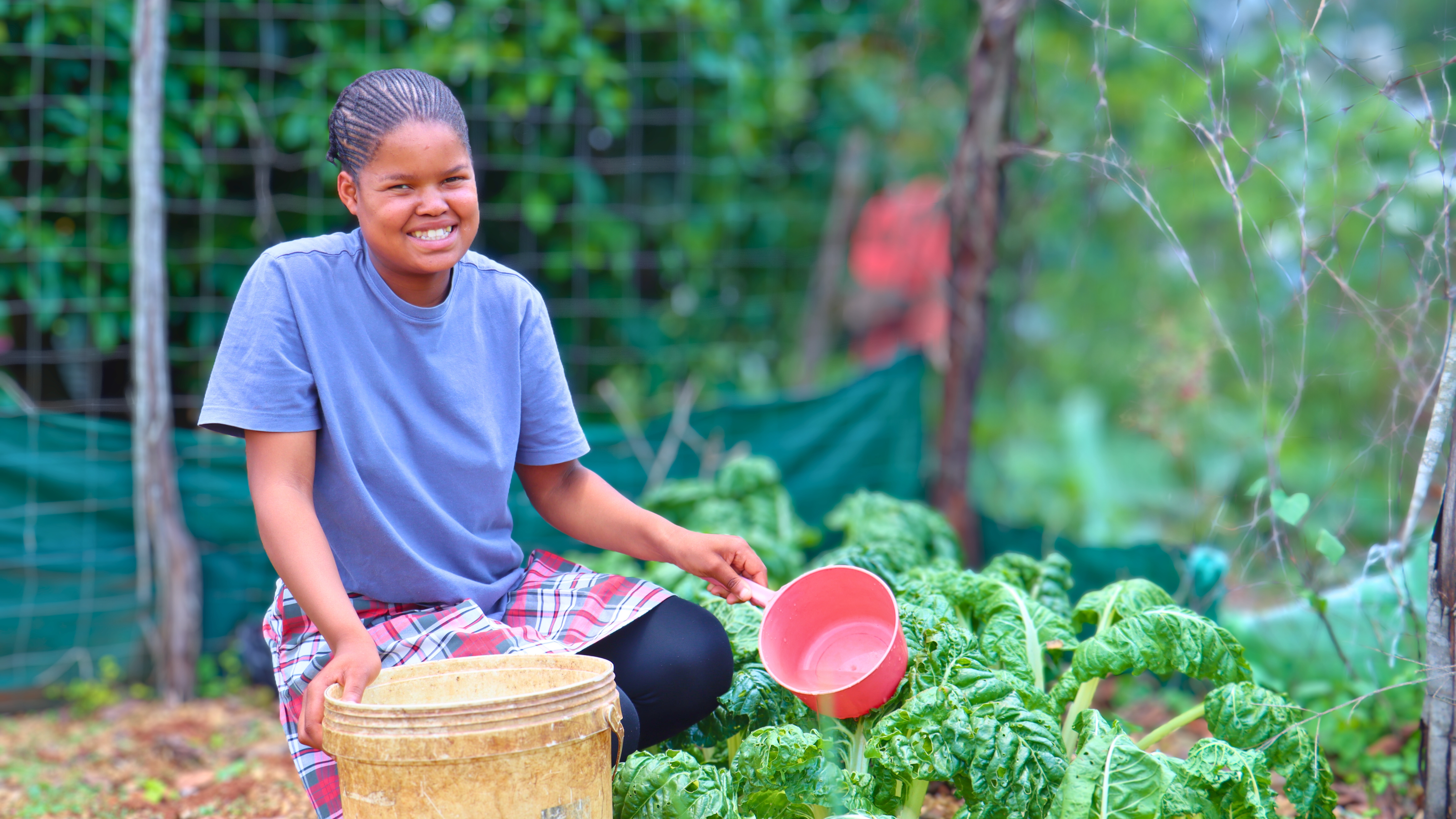 After World Vision brought water to her community, Sibonelo's family can now grow their own food.