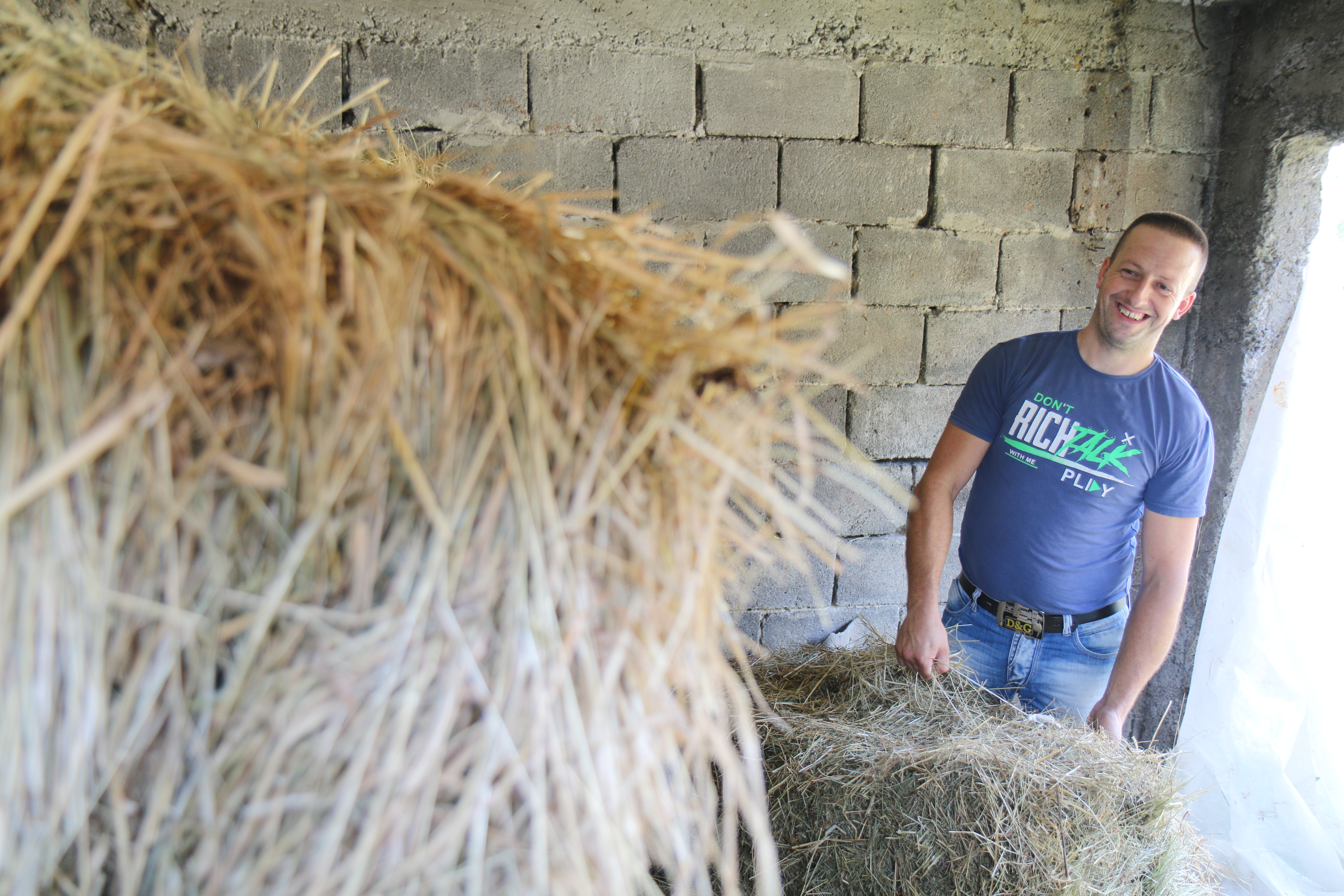 Dzevad stores hay for the winter