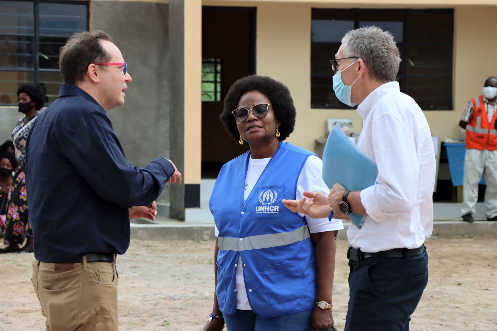 World Vision Zambia National Director John Hasse (left) talking to UNHCR Country Representative Perrine Aylara (centre) and EU Head of Cooperation Arnaud Borchard (right))