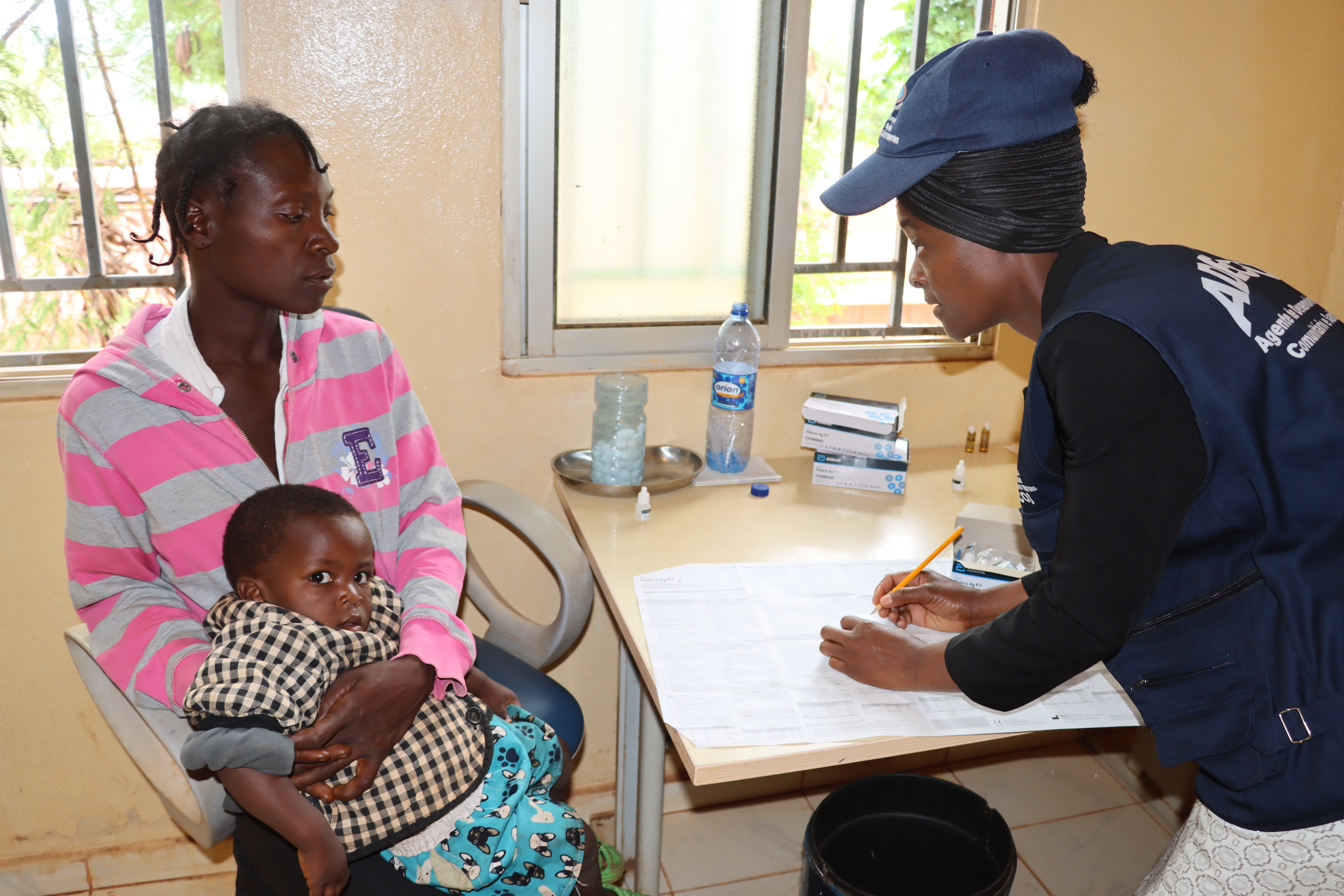ADECOS ADECOS conducting malaria testing